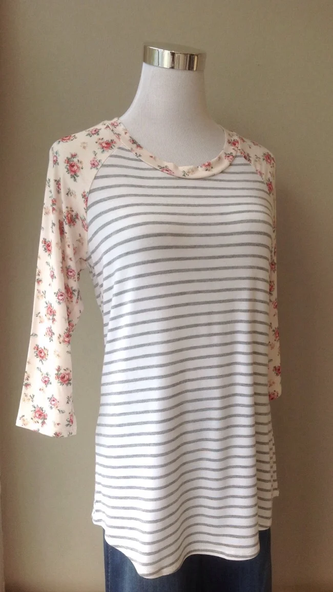 Grey and white stripe baseball top with pink floral sleeves, $28