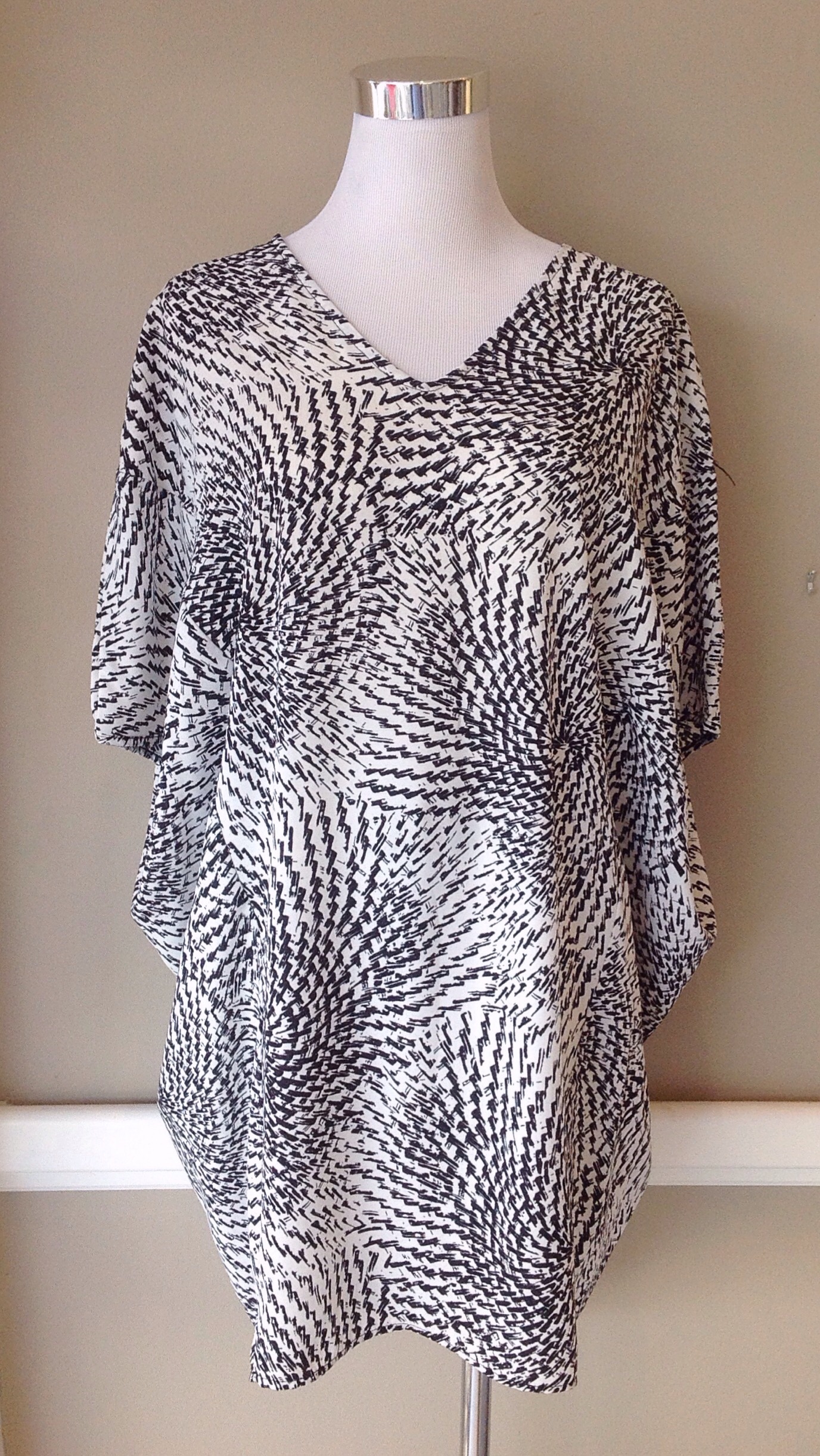 Black and white circle print tunic top, $34