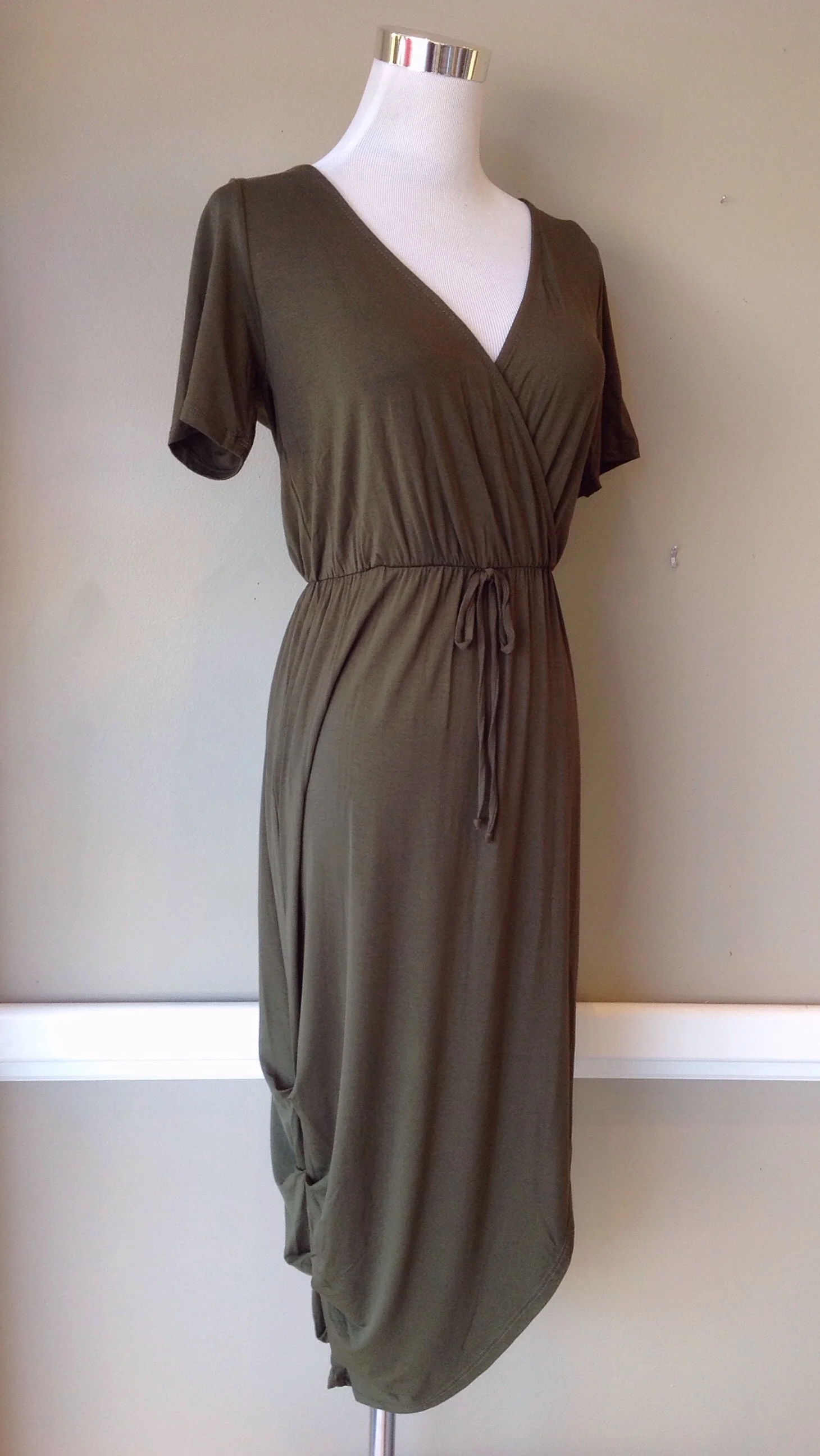 Olive knit dress with drawstring waist and ruched side seam, $42