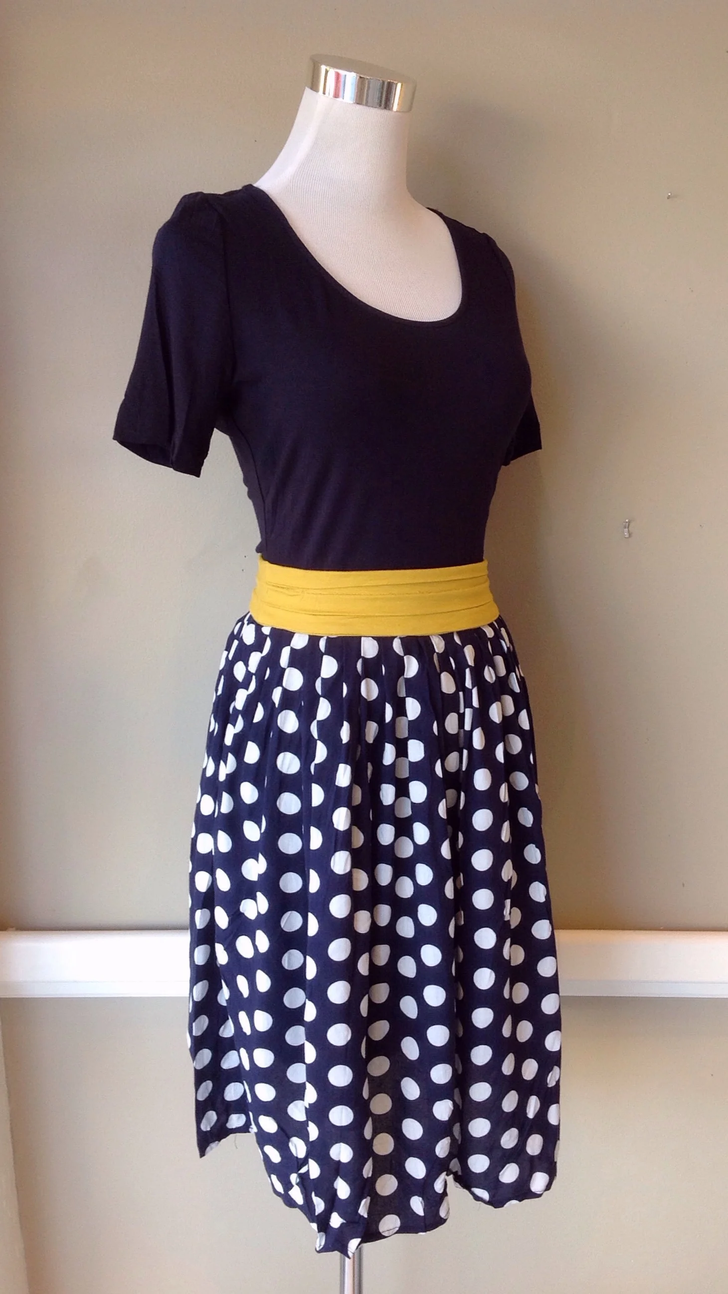 Dark navy dress with knit bodice and contrasting mustard belt, $42