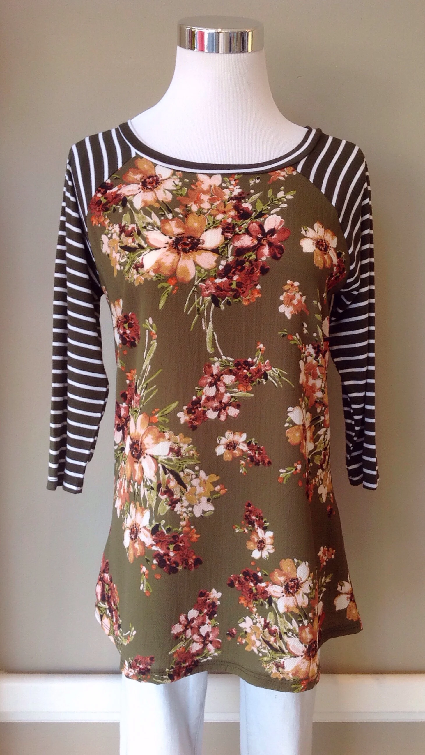 Woven floral print top with contrast knit sleeves, $28