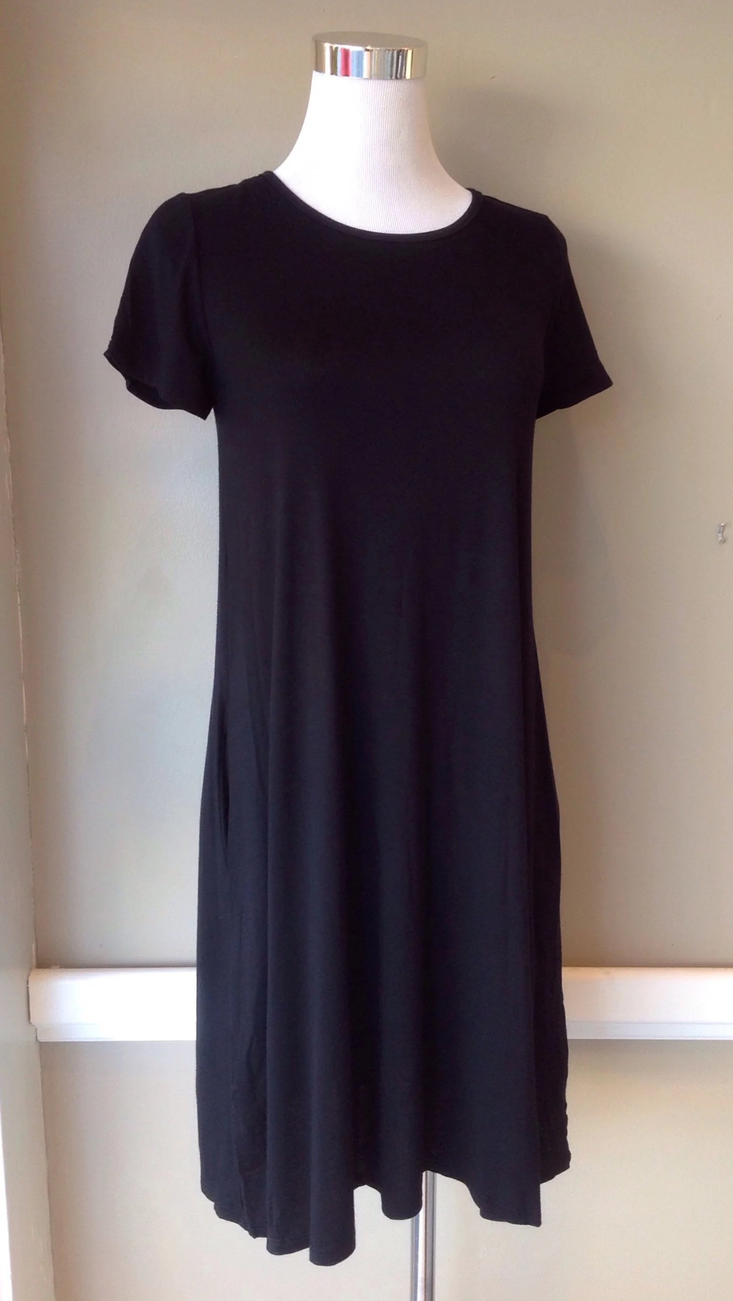 Black short sleeve t-shirt dress with side pockets, $34