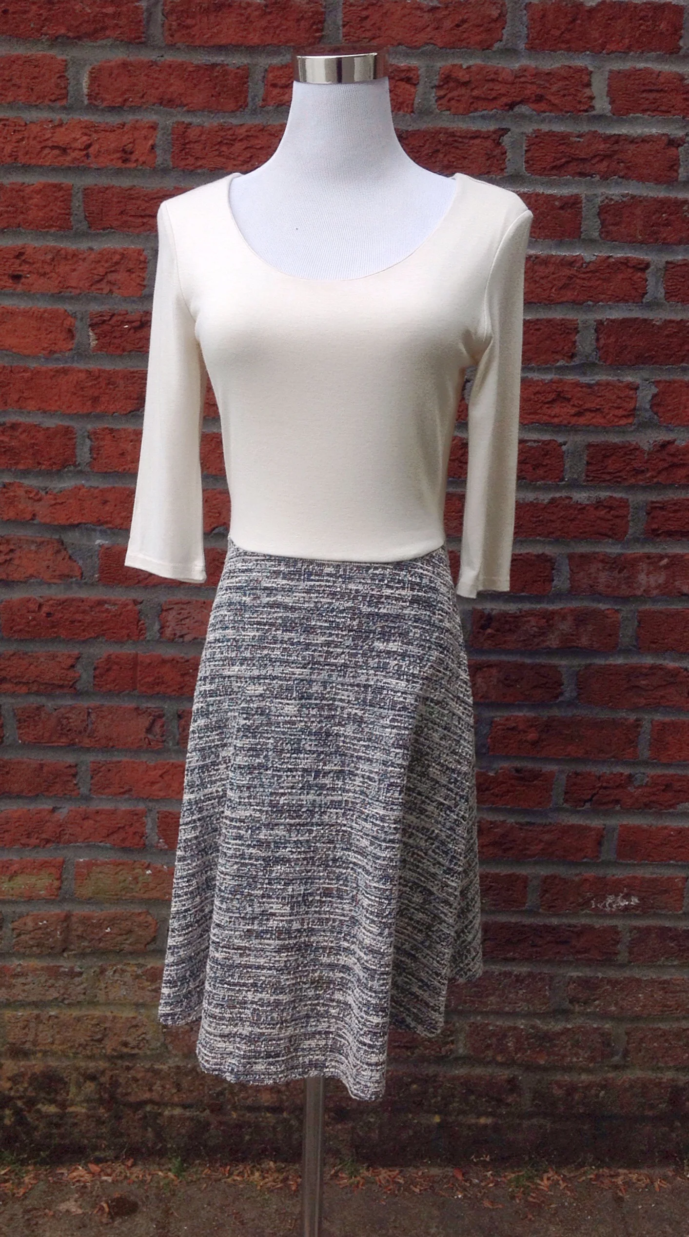 Scoop neck knit dress with contrasting textured skirt in ivory/grey
