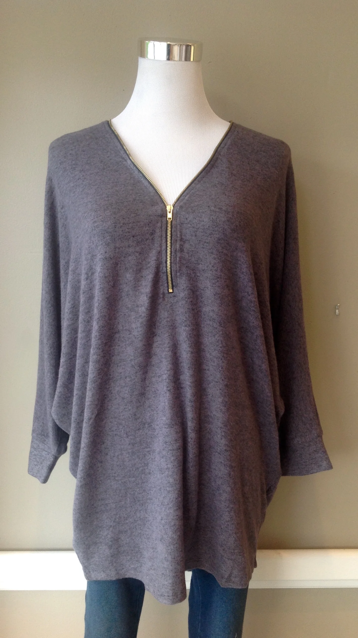 Zip front, fleecy knit sweater with batwing sleeves, $35. Also available in heather grey.