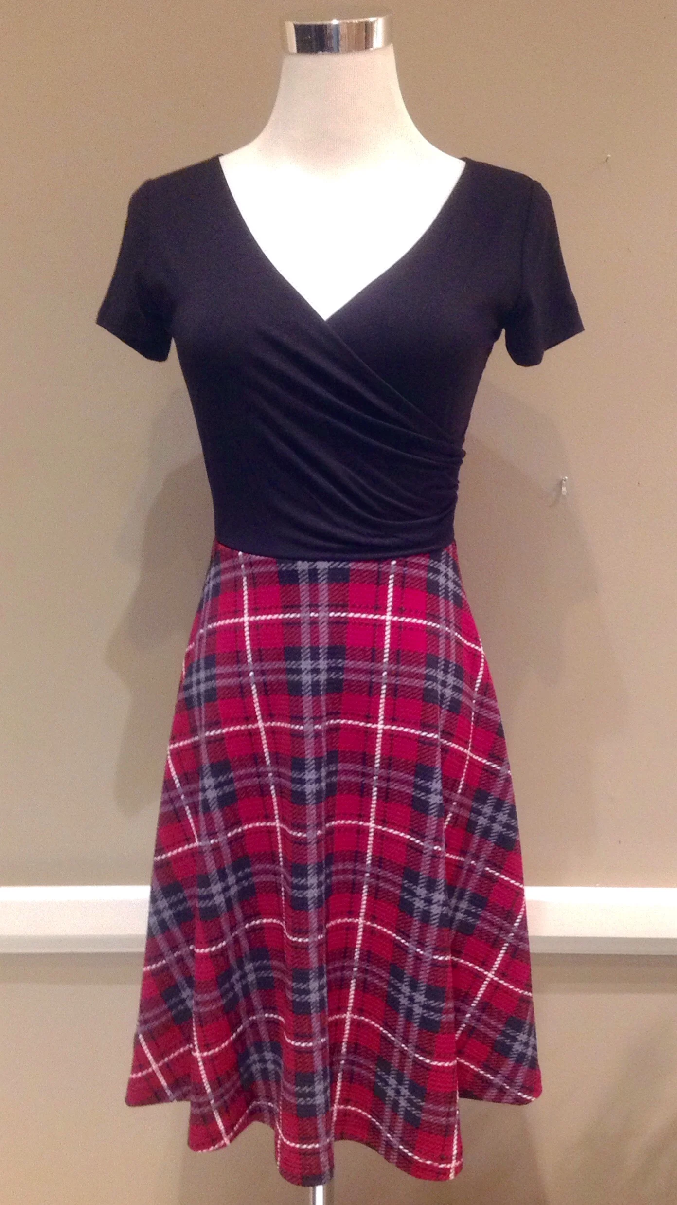 Knit wrap front dress with A-line skirt in black/red plaid, $42