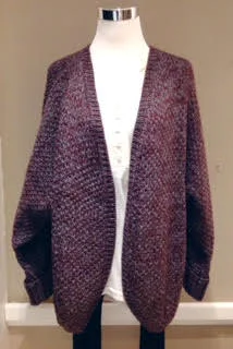 Chunky two-toned cardigan with rounded hem in burgundy, $52