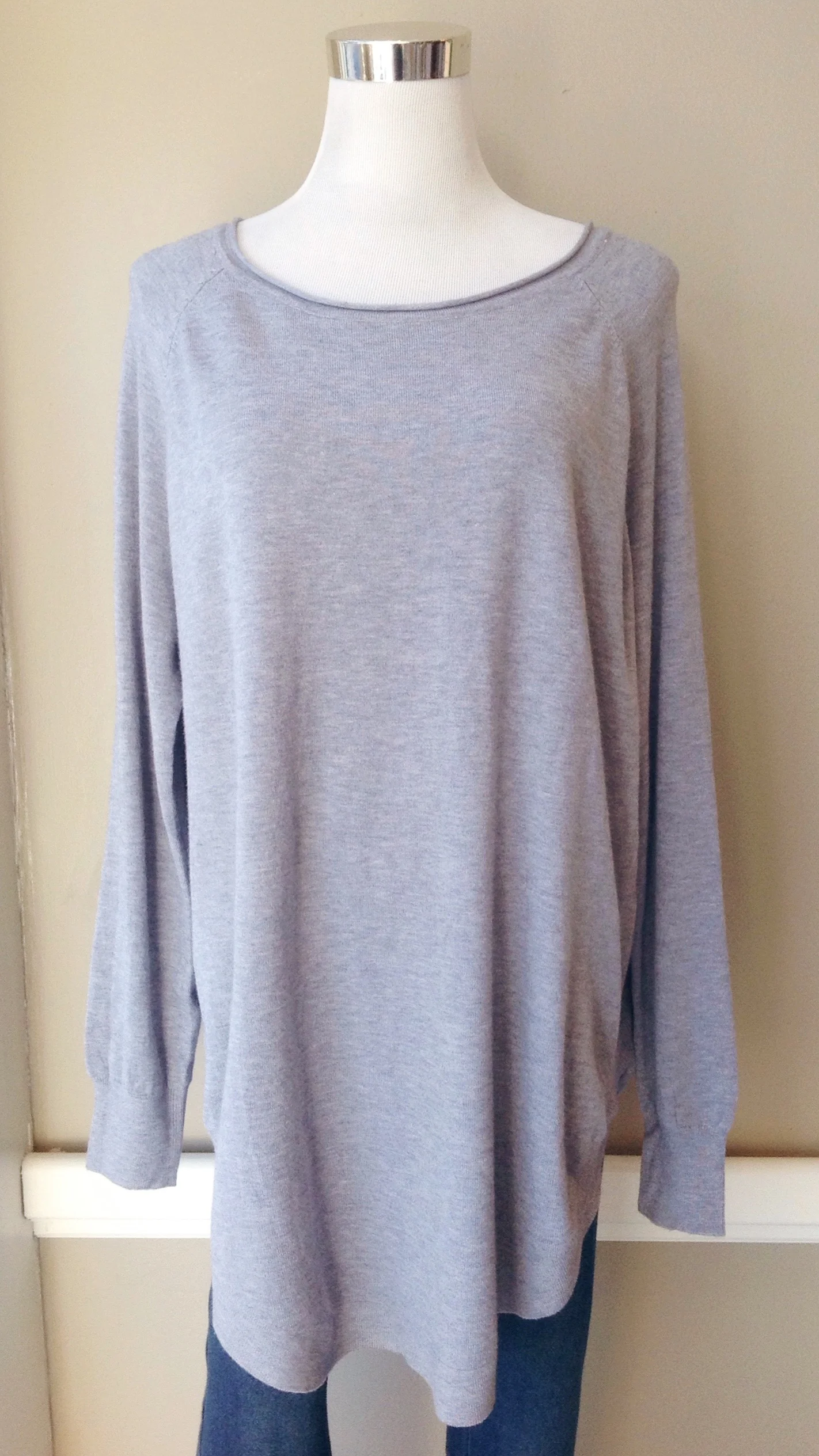 Ultra soft oversized sweater with rounded hem in dust blue, $40