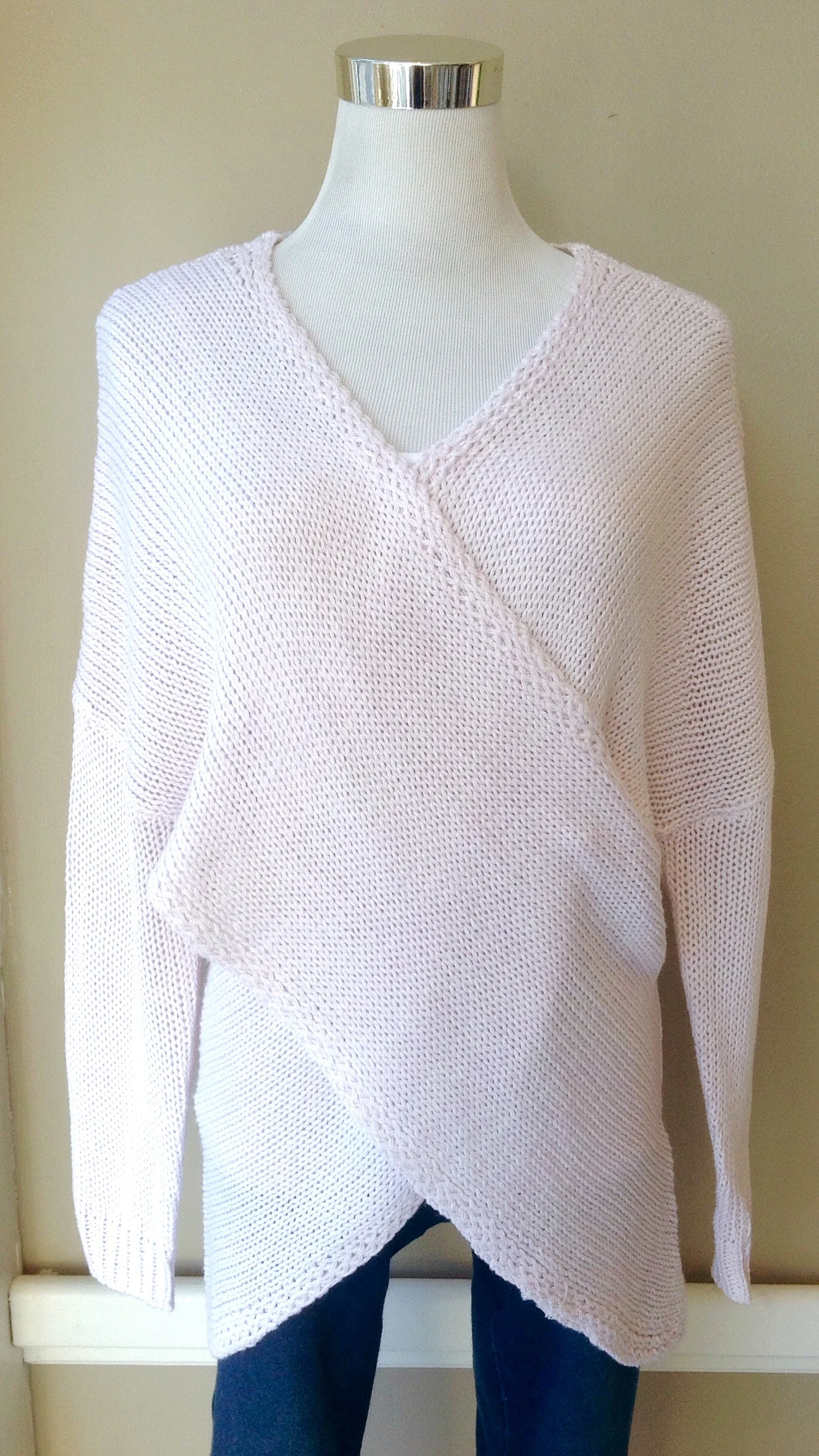 Cross front knit sweater in pale pink, $38