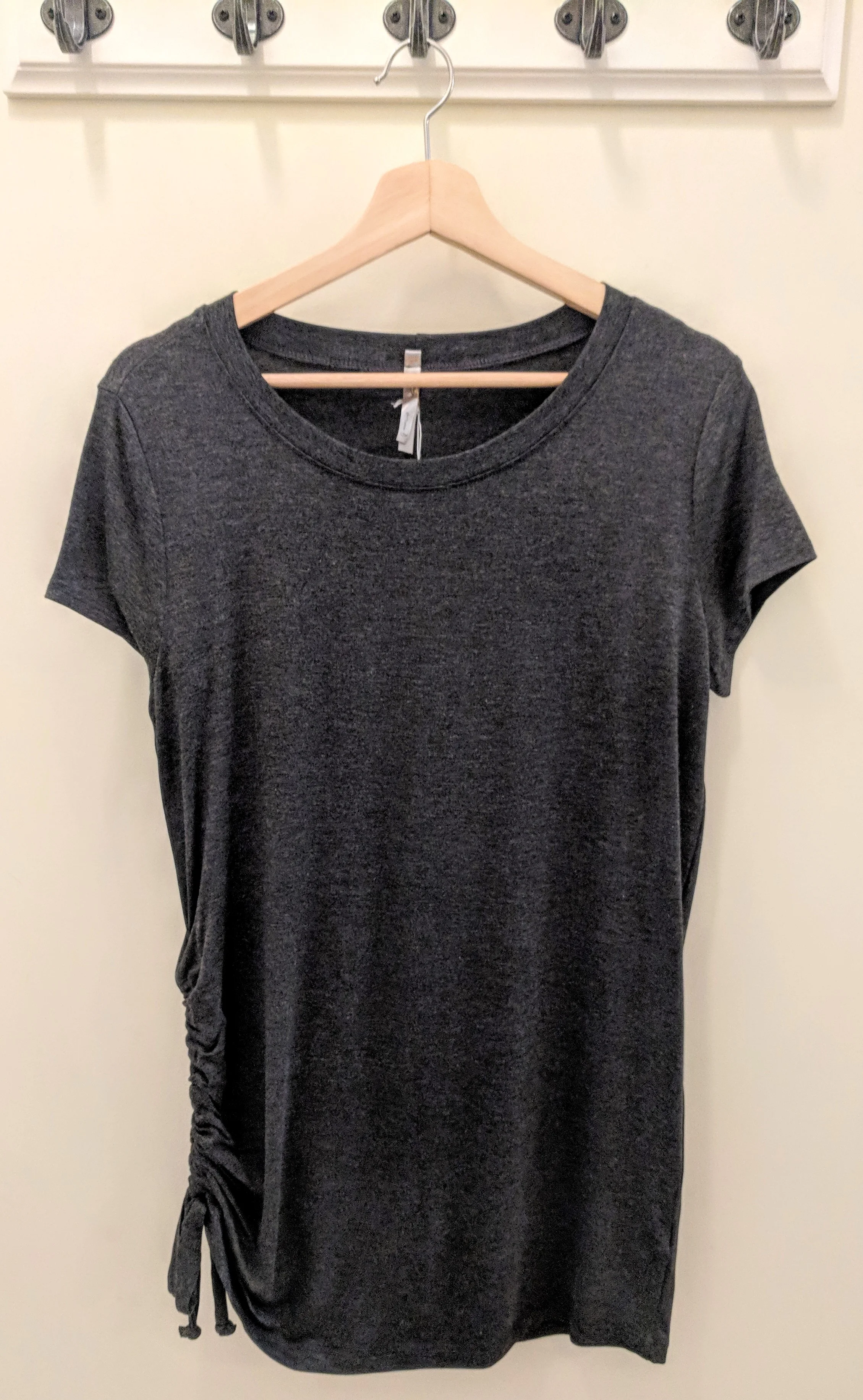 Charcoal knit tunic with adjustable drawstring on side. $28