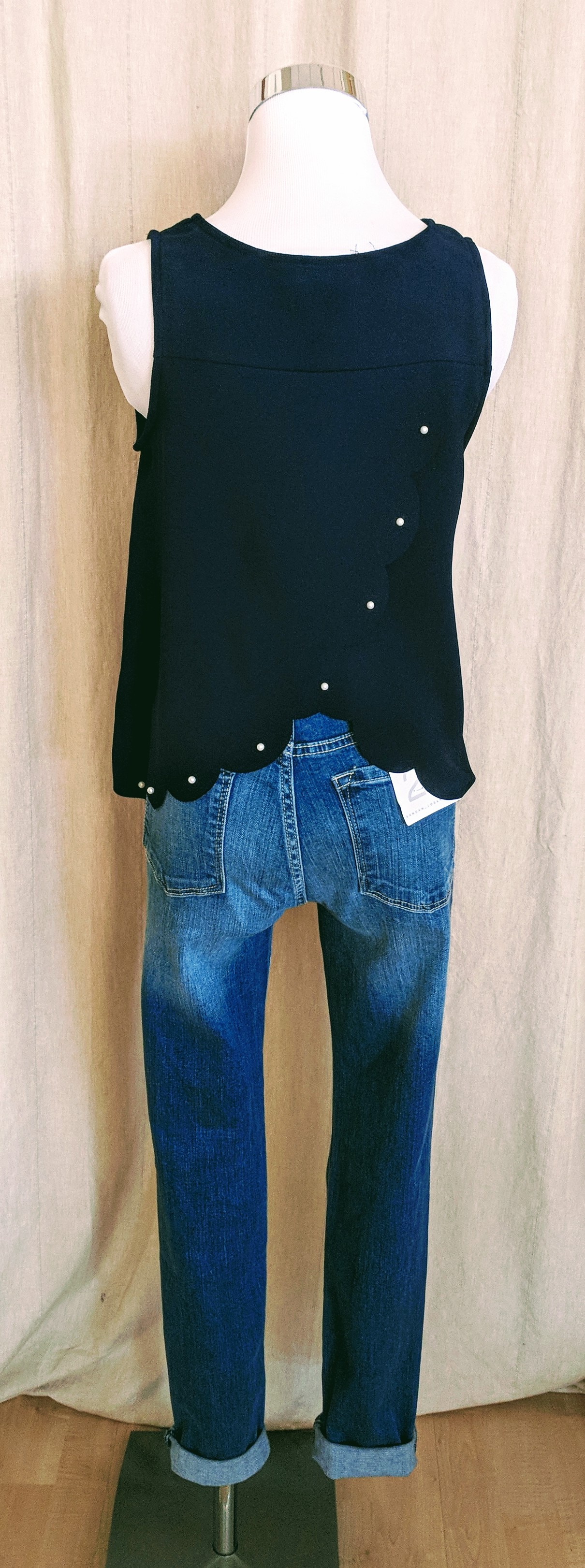 Navy Tank top with scallop and pearl detail on back. $28