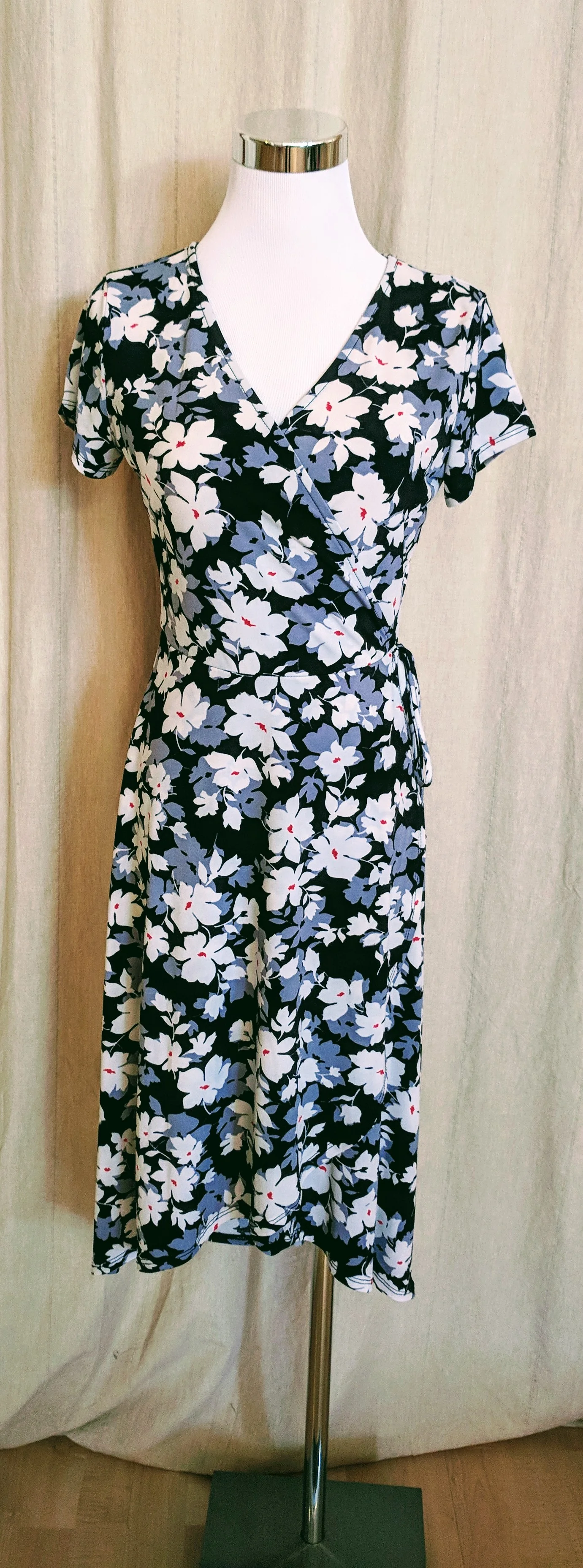 Black floral faux wrap midi dress. $52