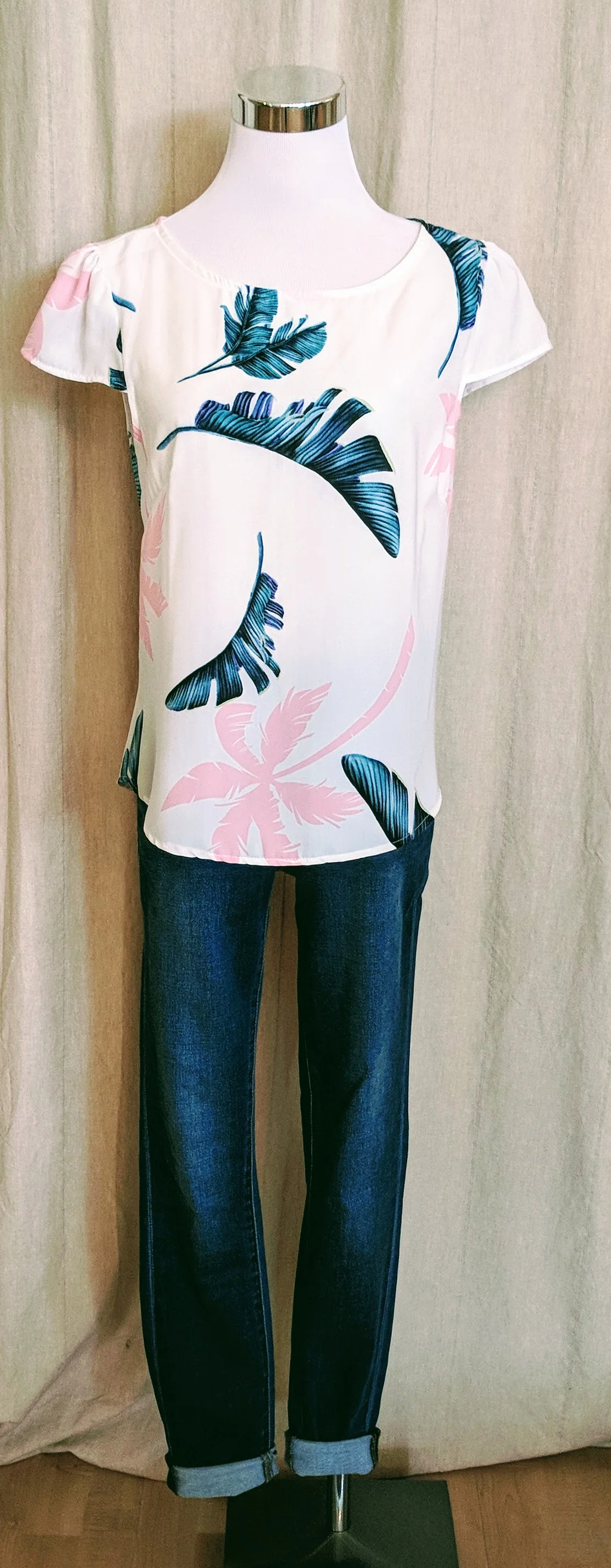 White tropical print top with cap sleeves. $28