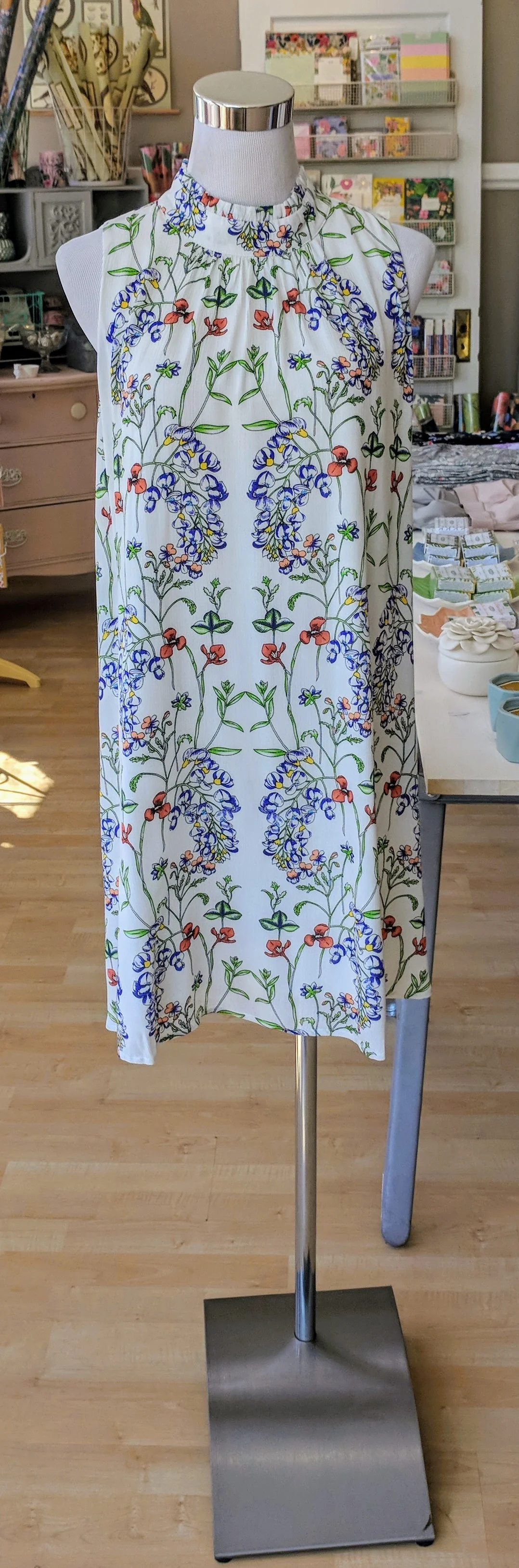 Ivory midi dress with gathered ruffle collar and key hole detail on back.