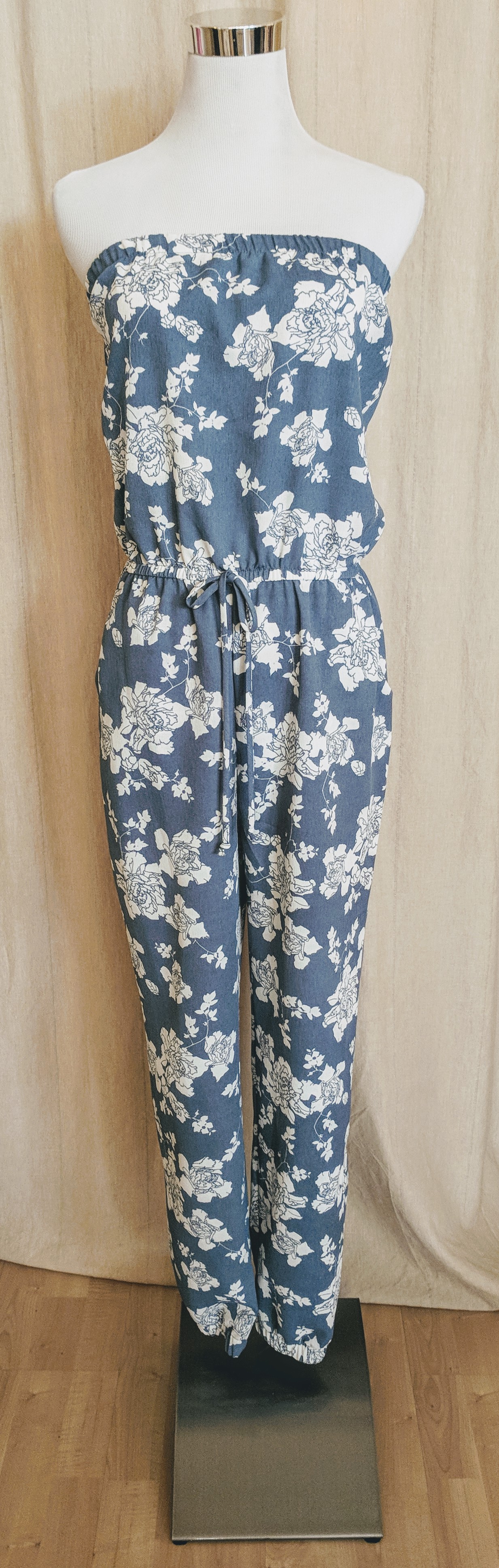 Light blue strapless Jumpsuit with pockets. 