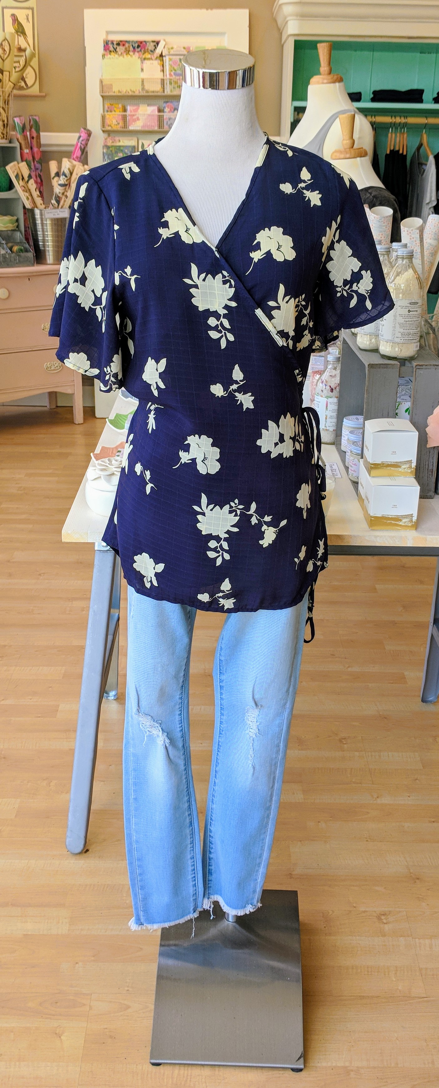 Navy wrap top with tie detail on waist. 