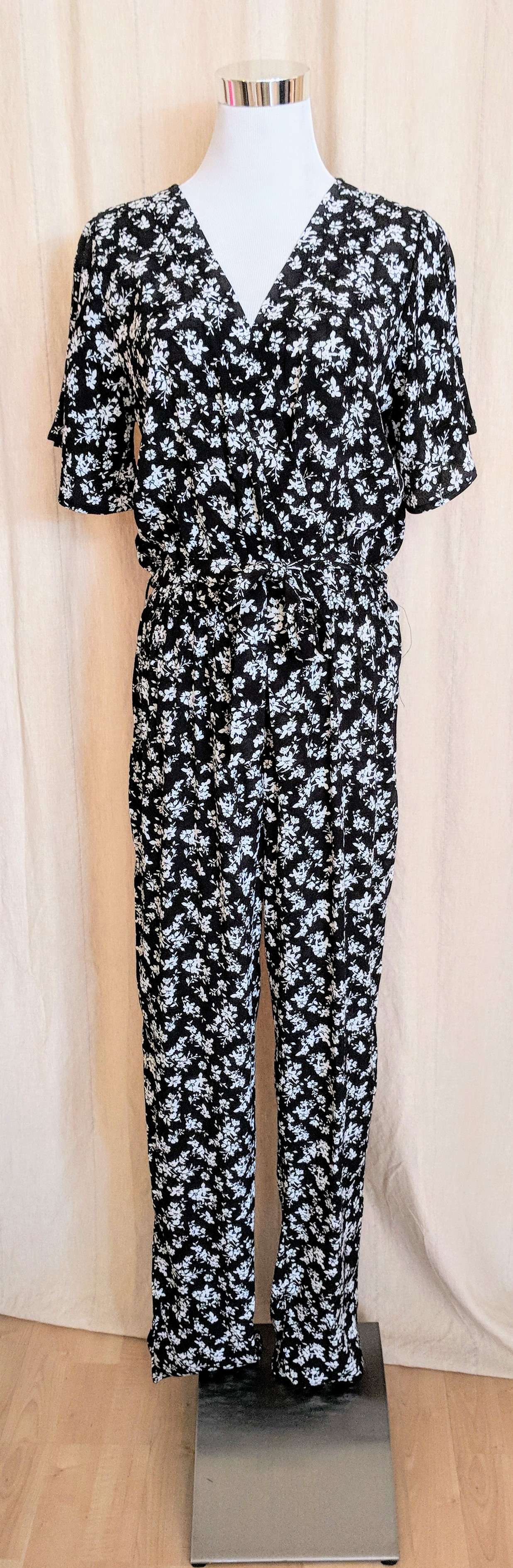 Black and Ivory floral jumpsuit with waist tie detail. 