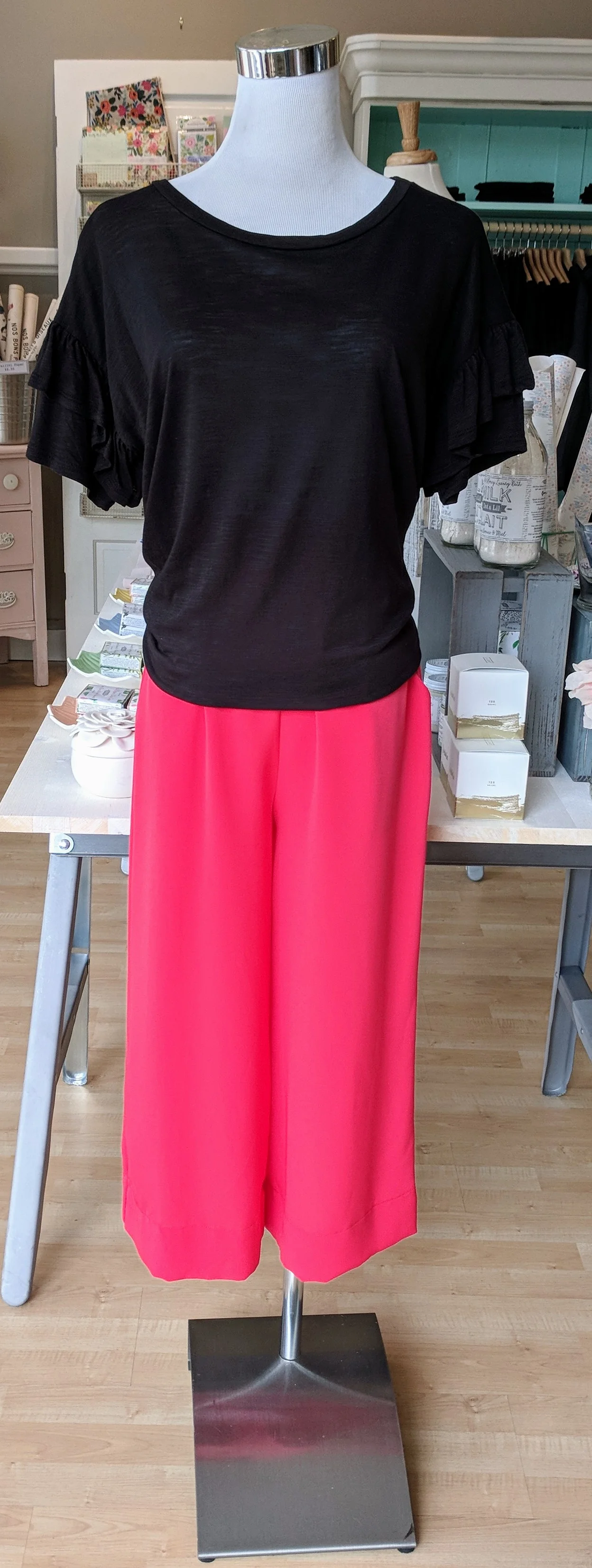 Coral Culotte pant with Black ruffle sleeve top. 