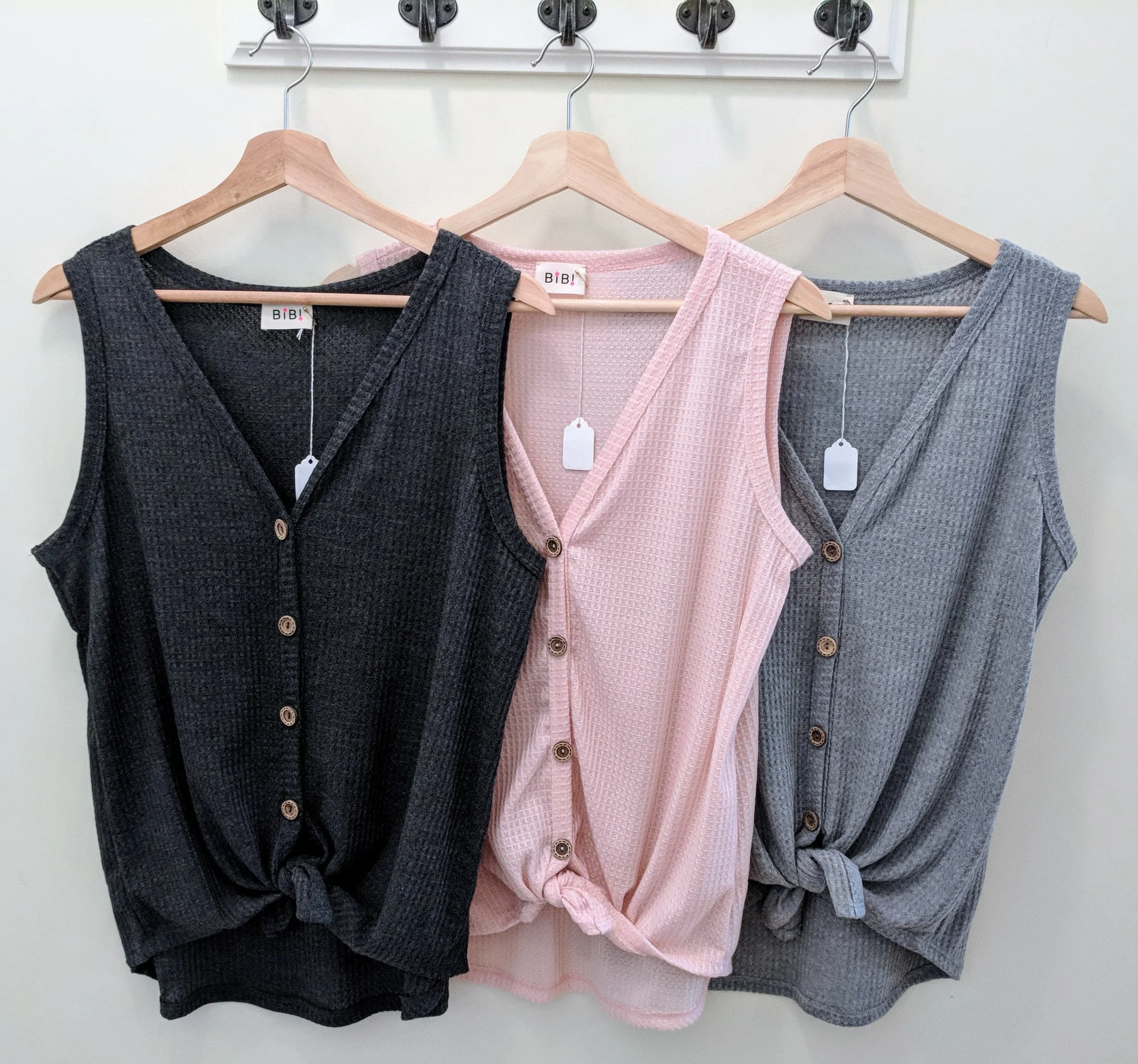 Sleeveless knit top with tie front. Heather grey, Charcoal and Blush.