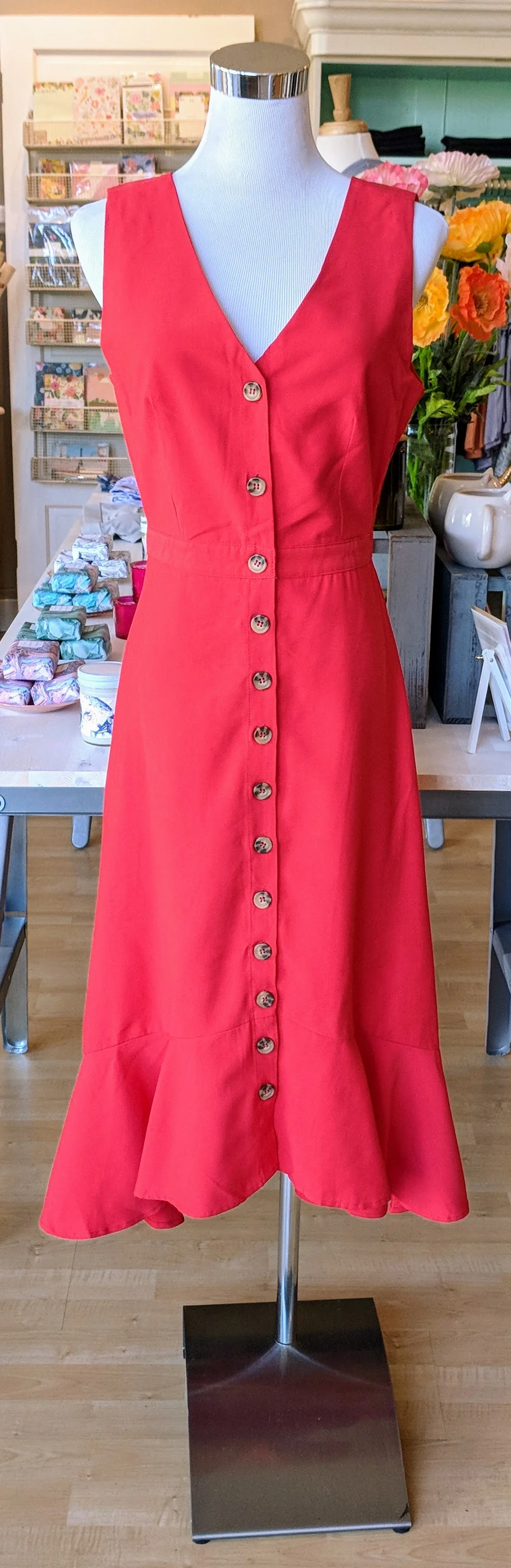 Red woven dress with ruffle hem. 