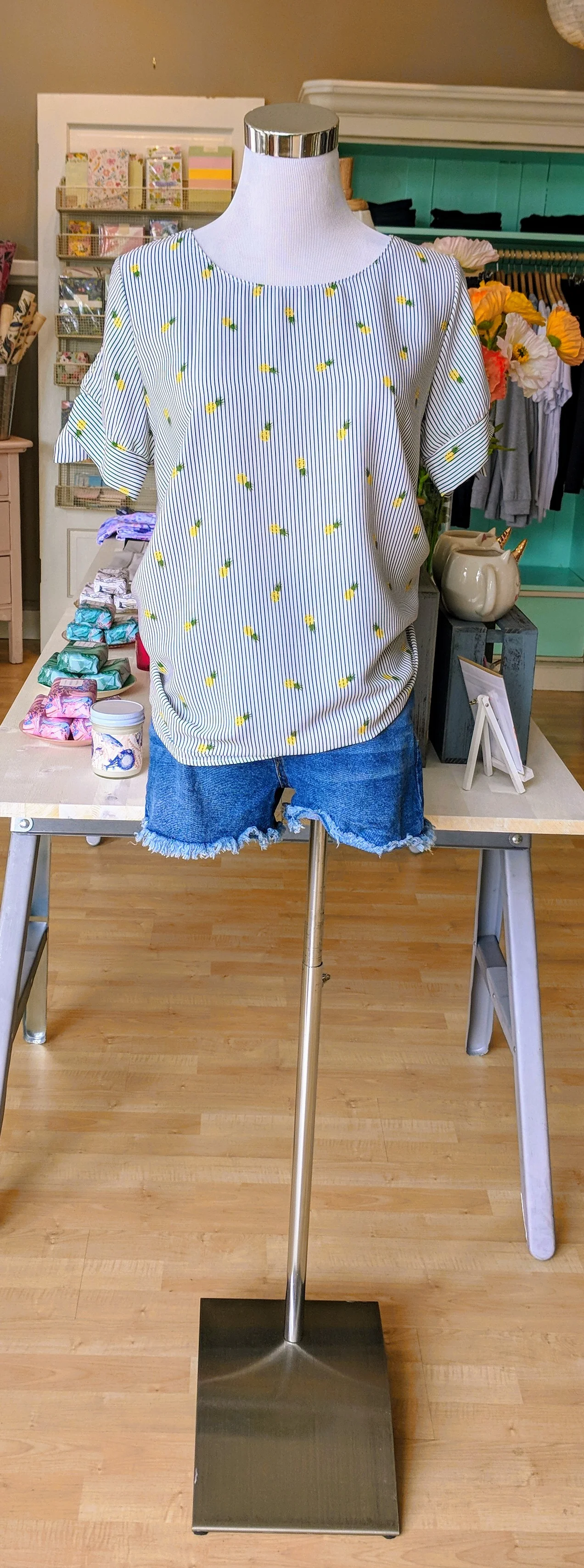 Black and White stripe pineapple top with tie detail on sleeves.