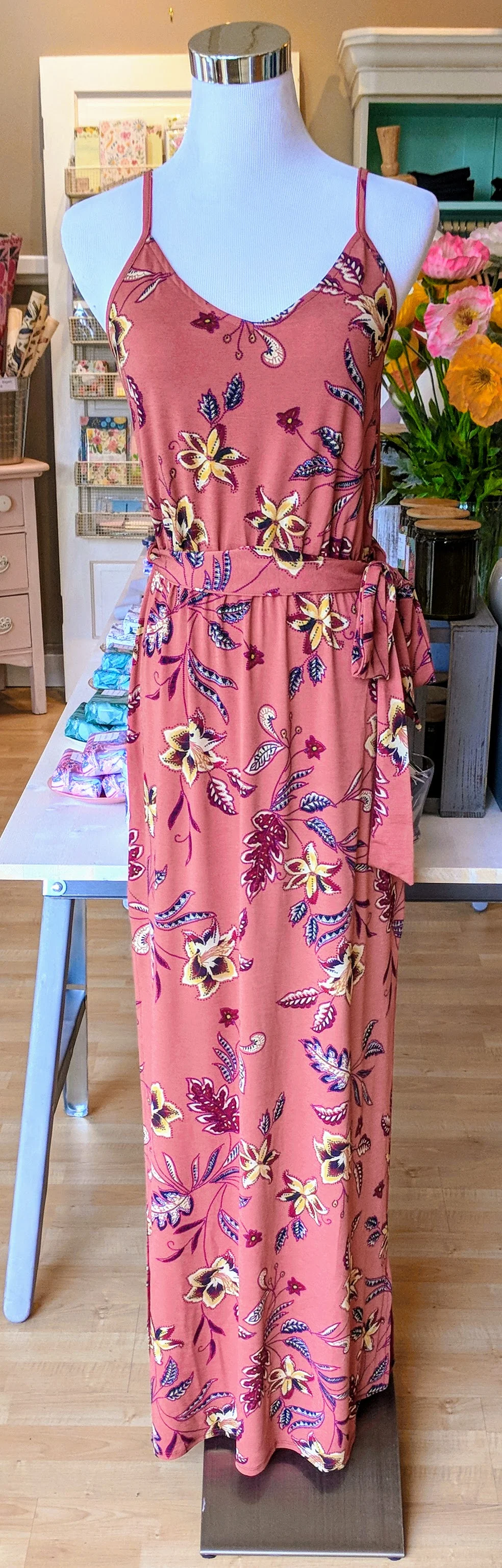 Rust floral maxi dress with side slit. 