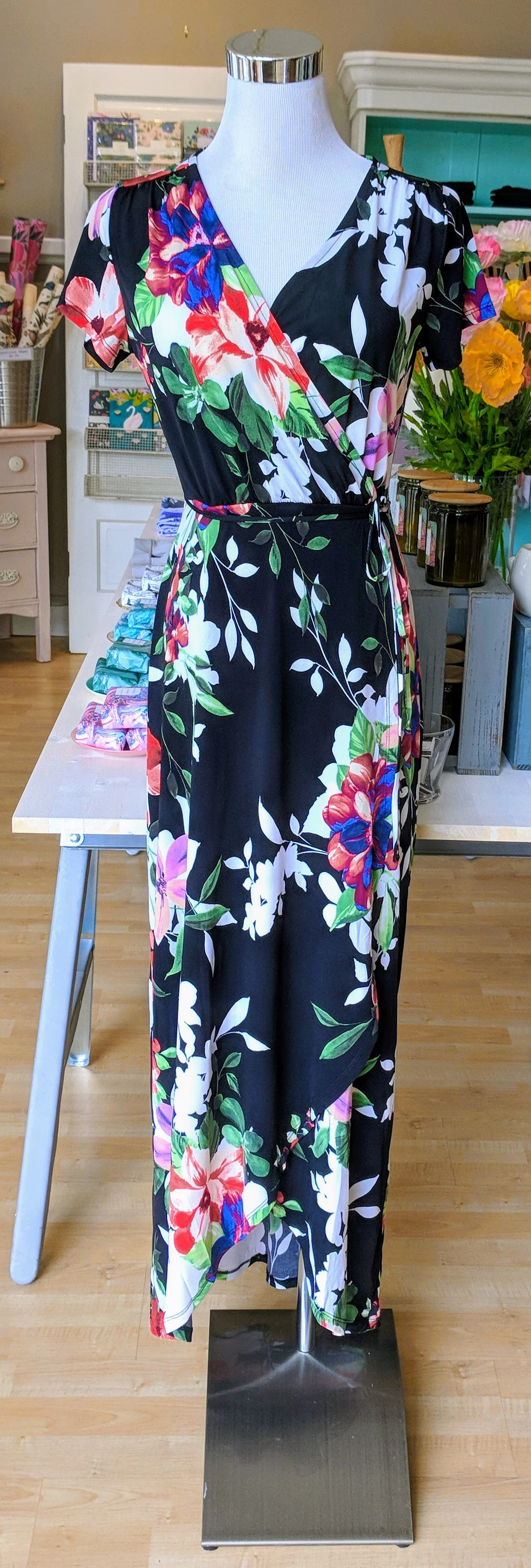 Black floral maxi dress with an overlapped waist. 