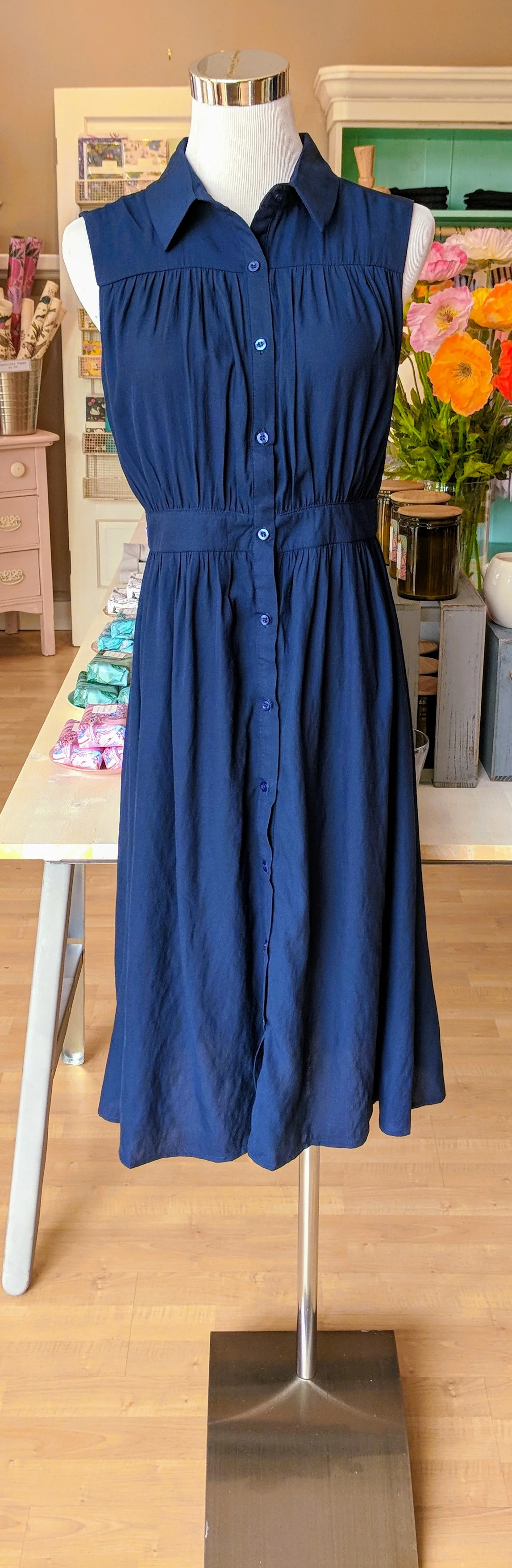 Navy collared midi dress with button up front. 