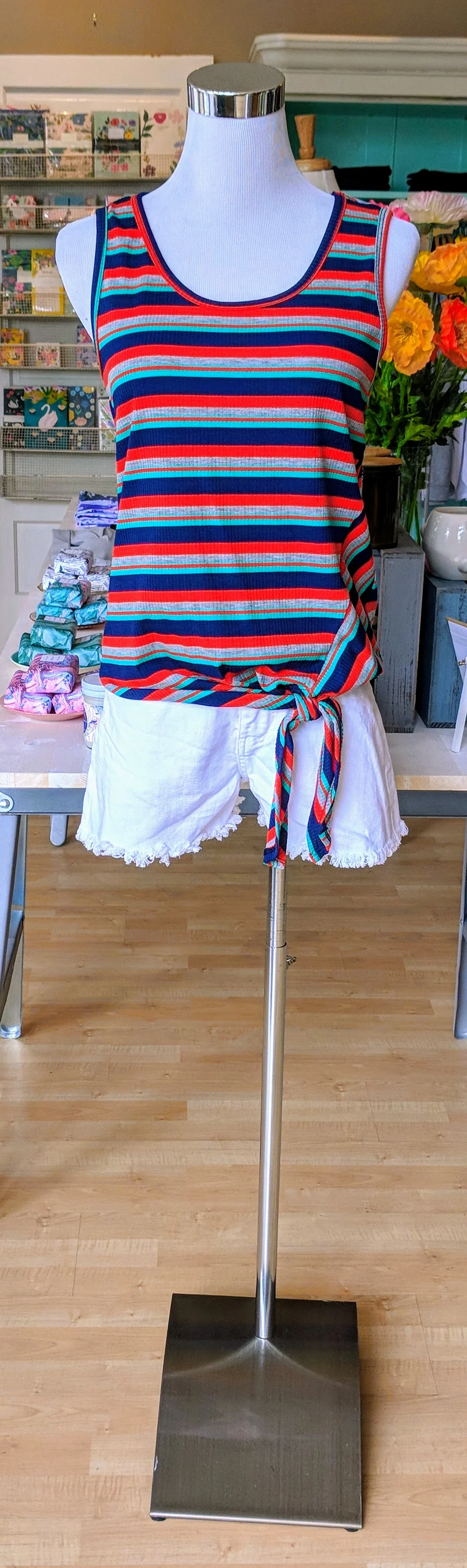 Navy and coral striped tank with knotted hem. 