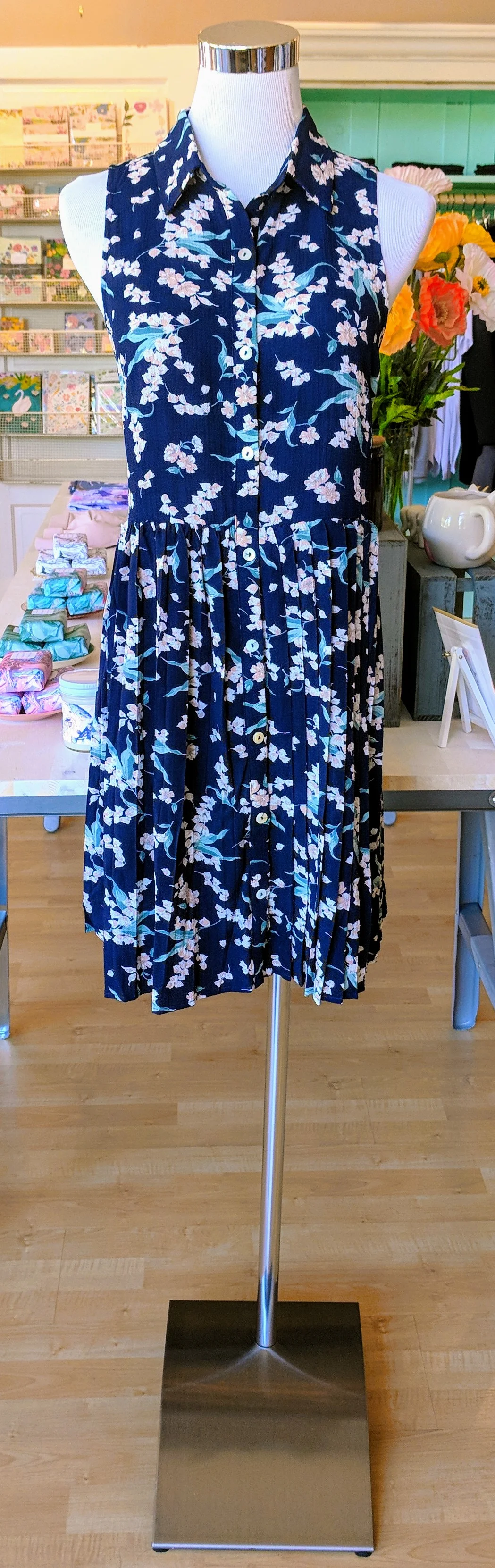 Navy floral dress with pleated bottom. 