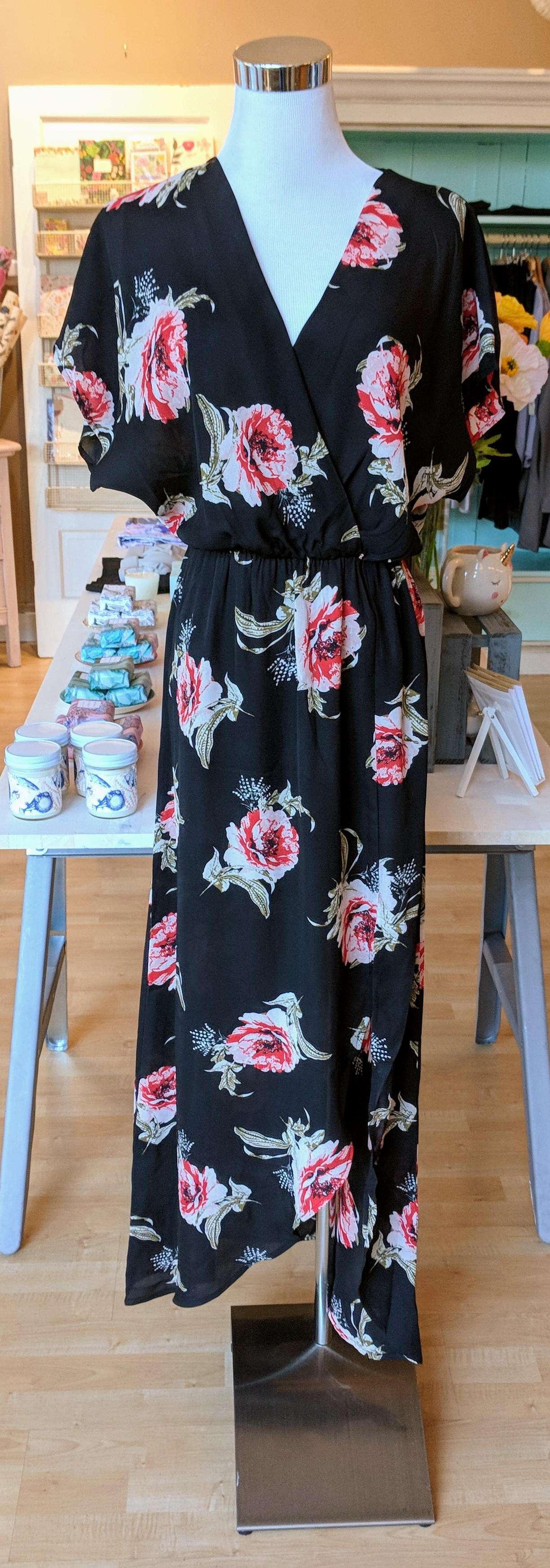 Black floral wrap dress with dolman sleeve. 