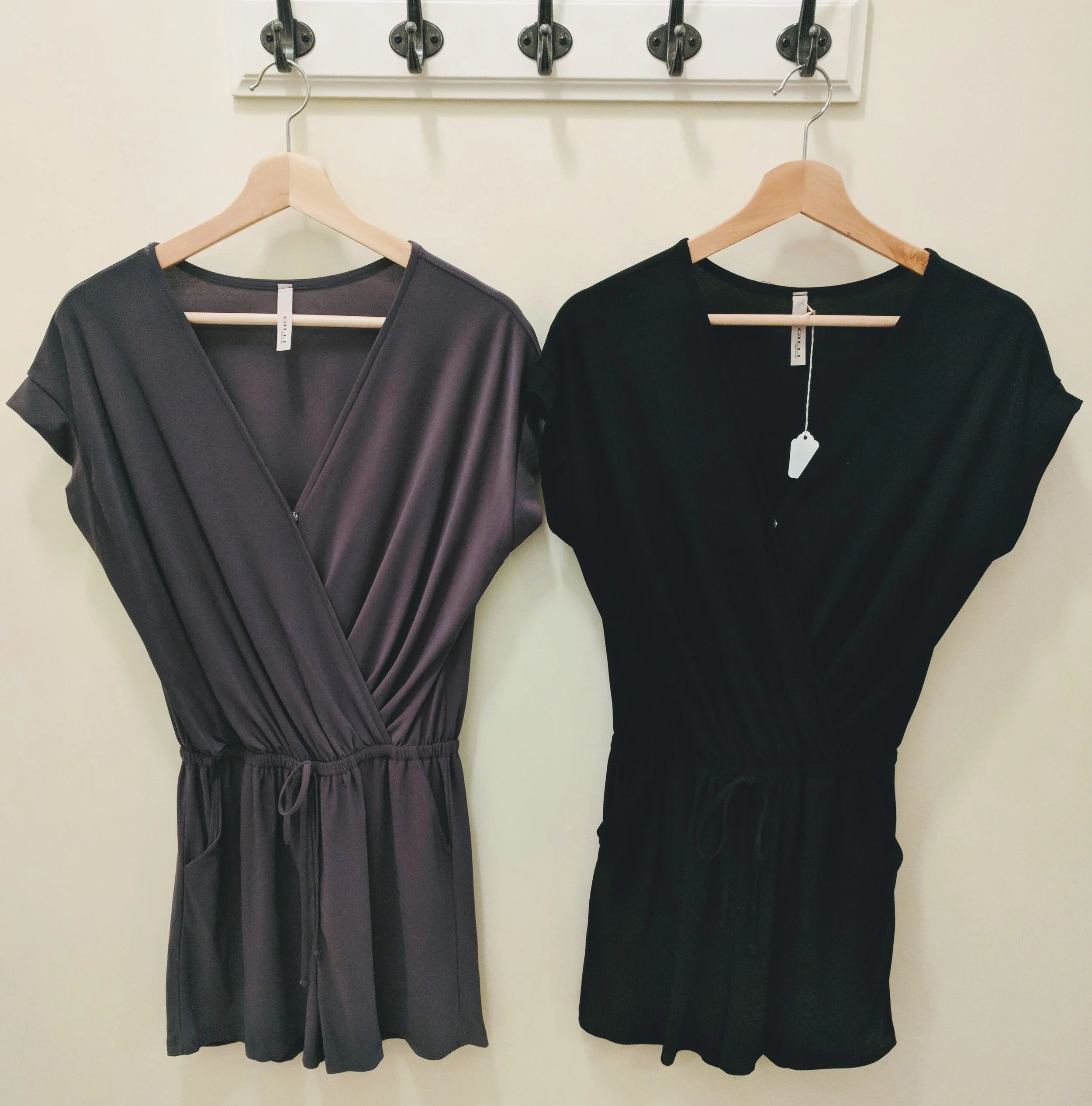Charcoal and black wrap romper with tie waistband. 
