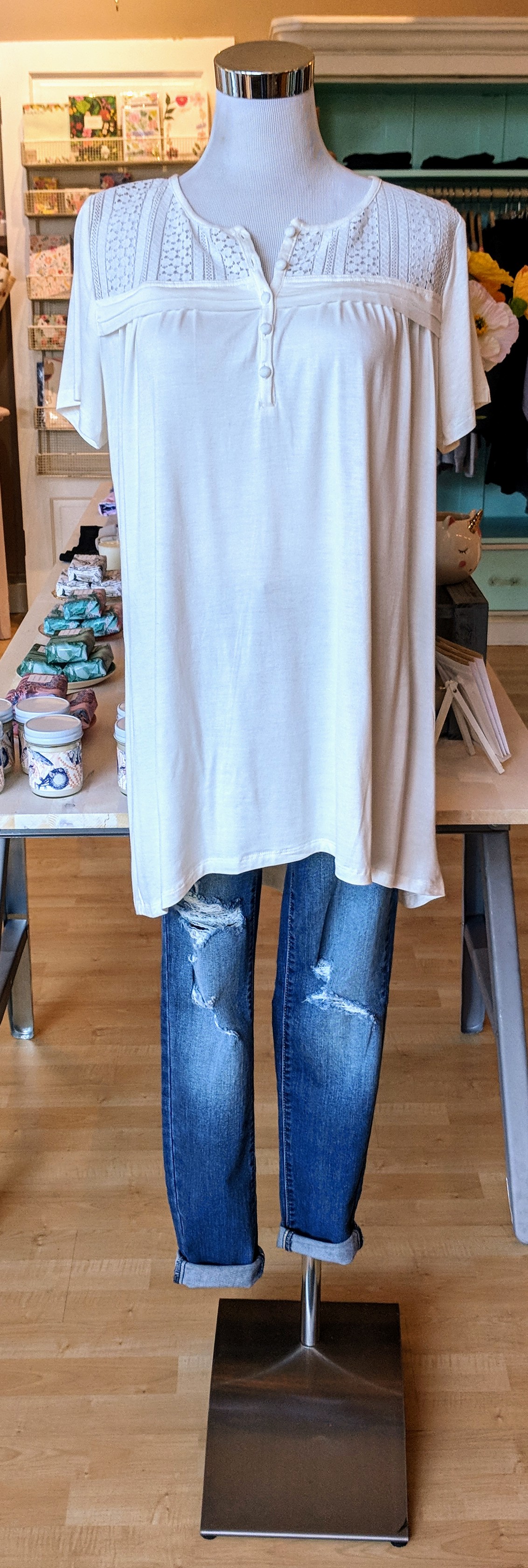 White tunic top with lace embroidery and buttons. 