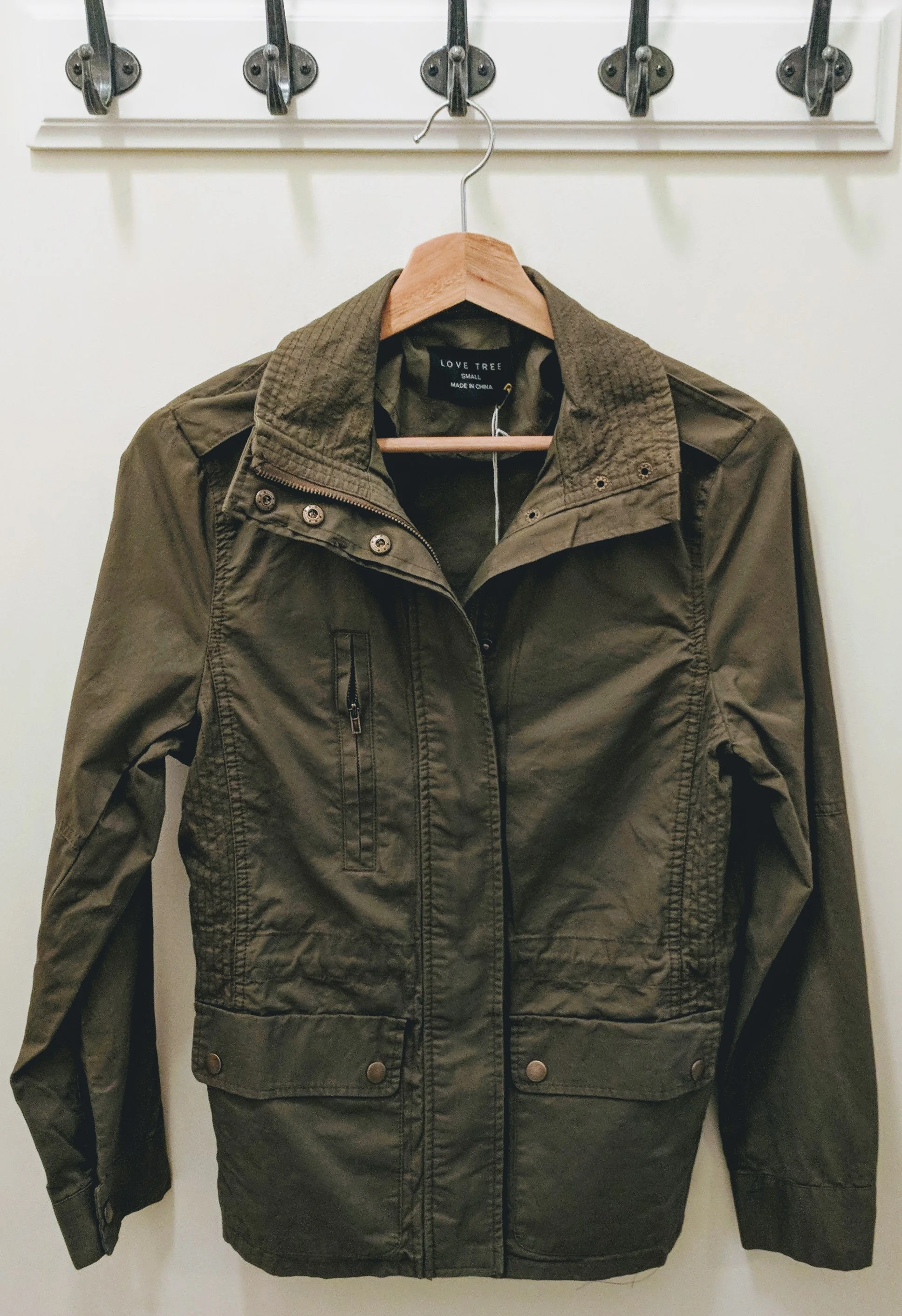 Olive utility jackets with elastic adjustable waistband. 
