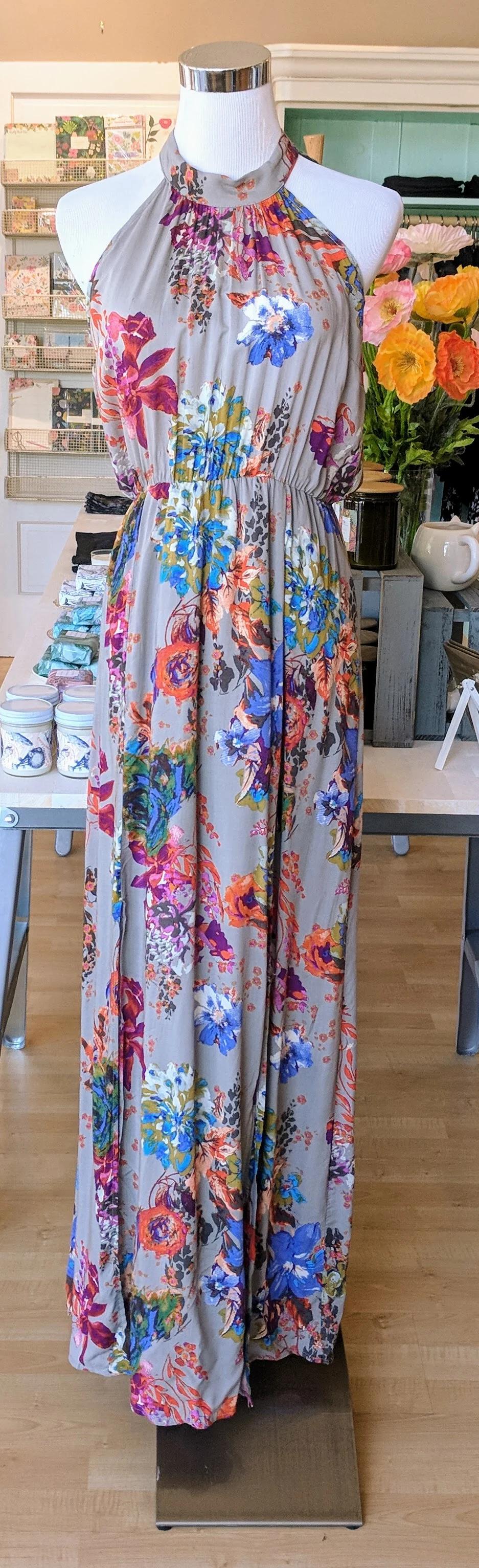 Heather Grey floral print maxi dress with side slits and a tie neck. 