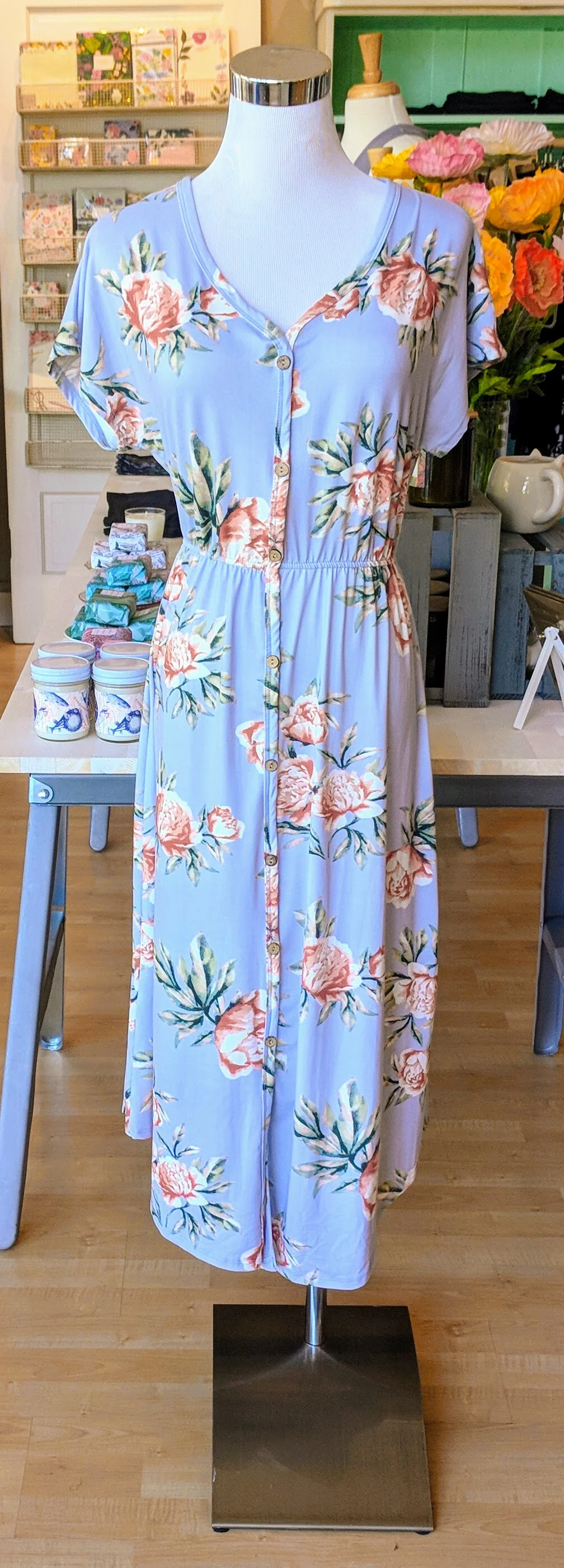 Pastel floral midi dress with button detail front. 