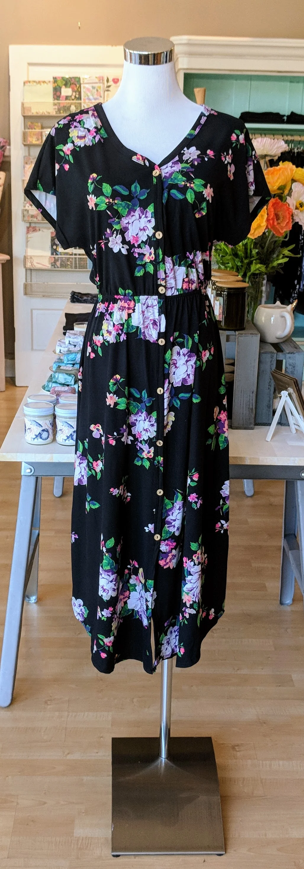 Black floral midi dress with button detail front. 