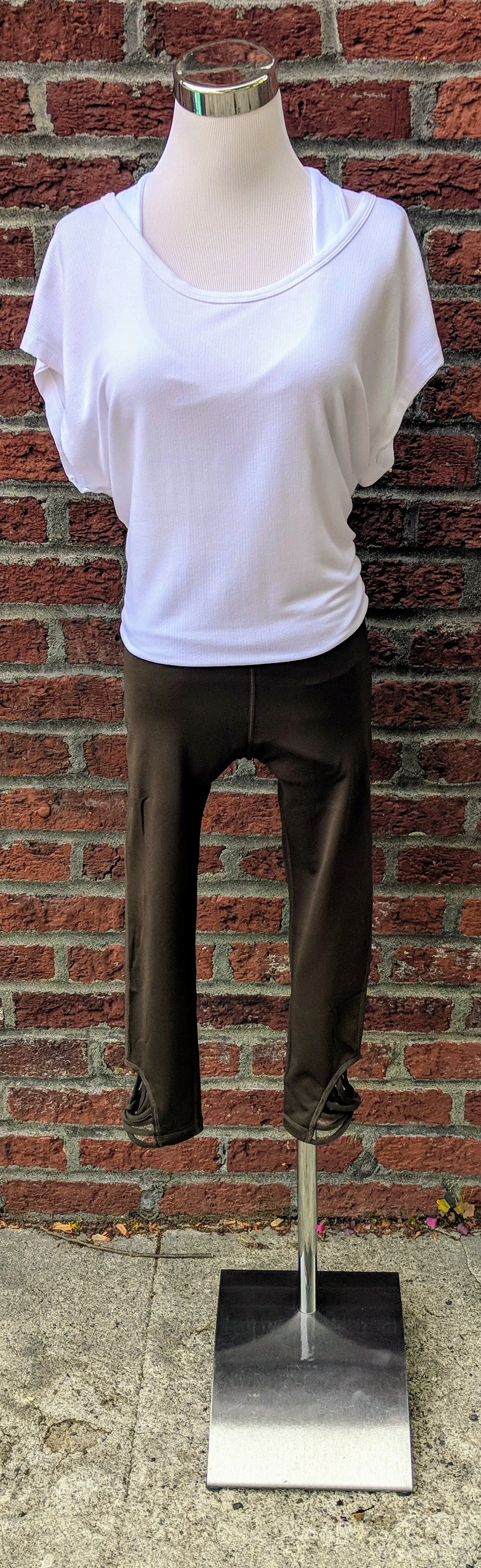 Olive knit capri legging with webbing detail on bottom. 