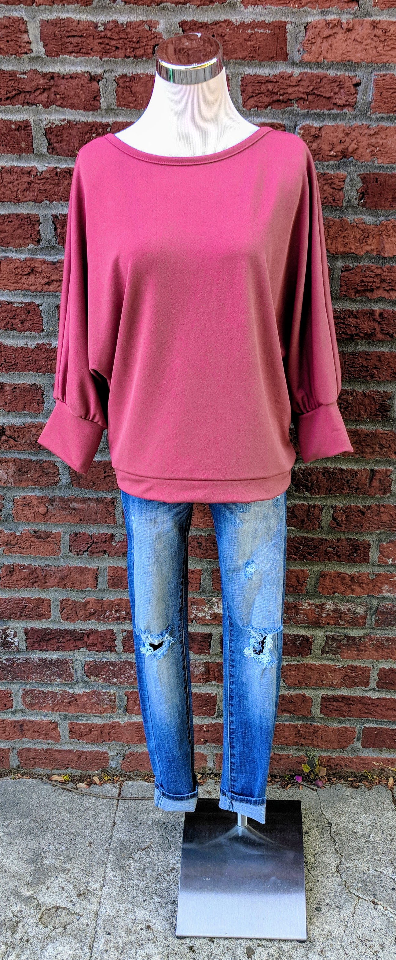 Orchid super soft top with fly away back and balloon sleeve. 