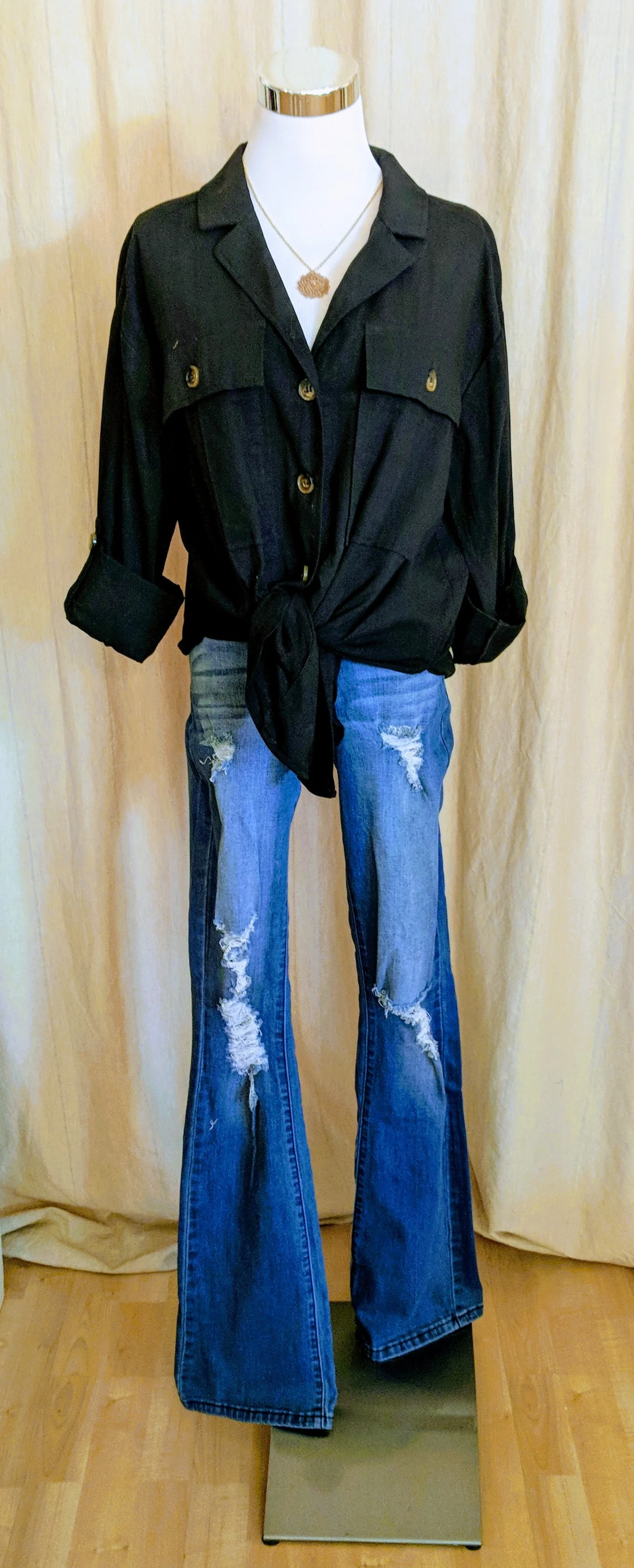 Black linen open collar top with buttons and knot front. 