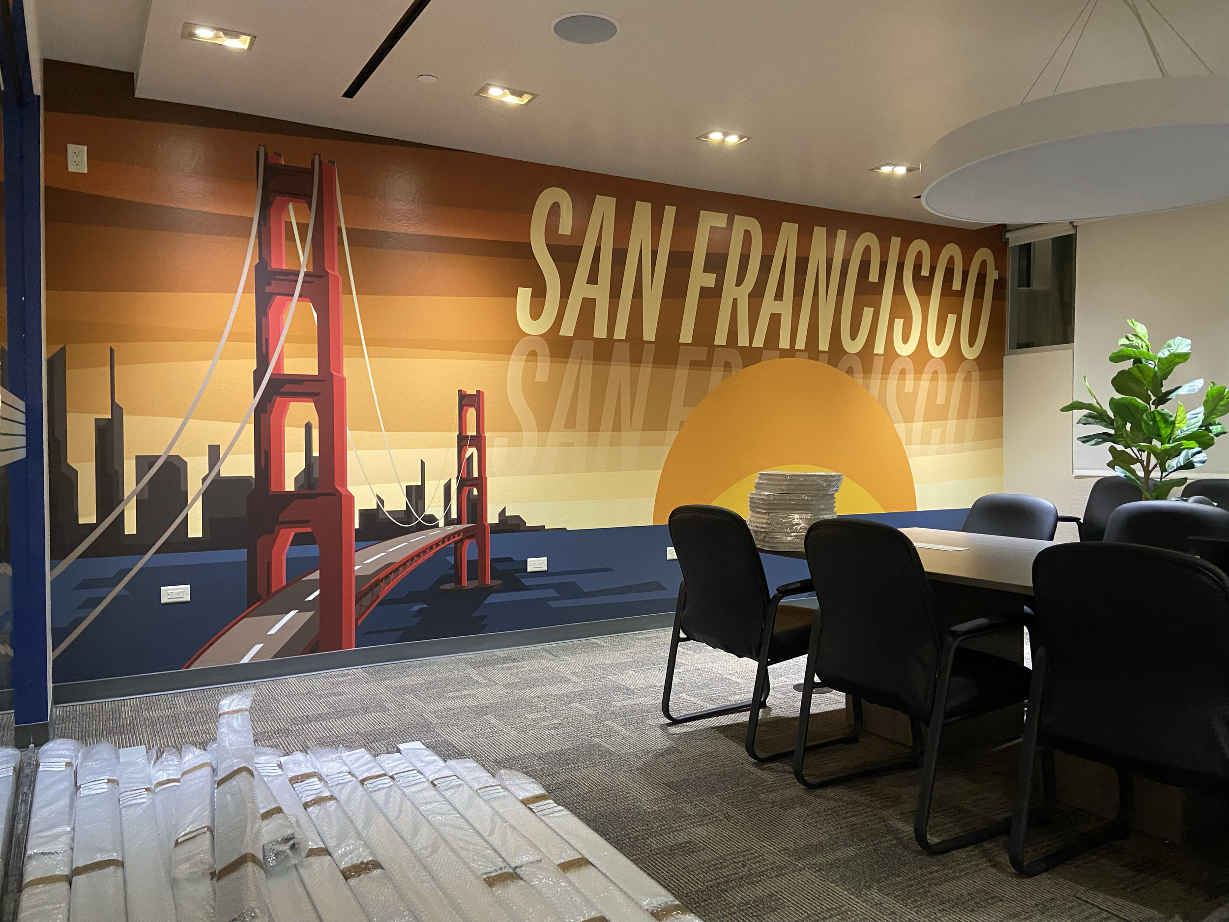 I led the remodel of the new WHSmith North America office in Las Vegas. To bring in a mid-century modern feel and reflect the states where the brand operates, I designed a series of vintage postcard graphics used as framed art and conference room wal