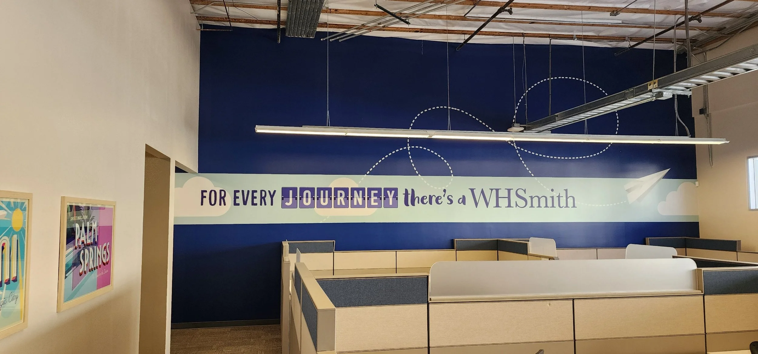 In addition to the framed postcard series, I used the opportunity to integrate the company’s tagline across a large feature wall, turning it into a graphic focal point rather than a blank surface.
