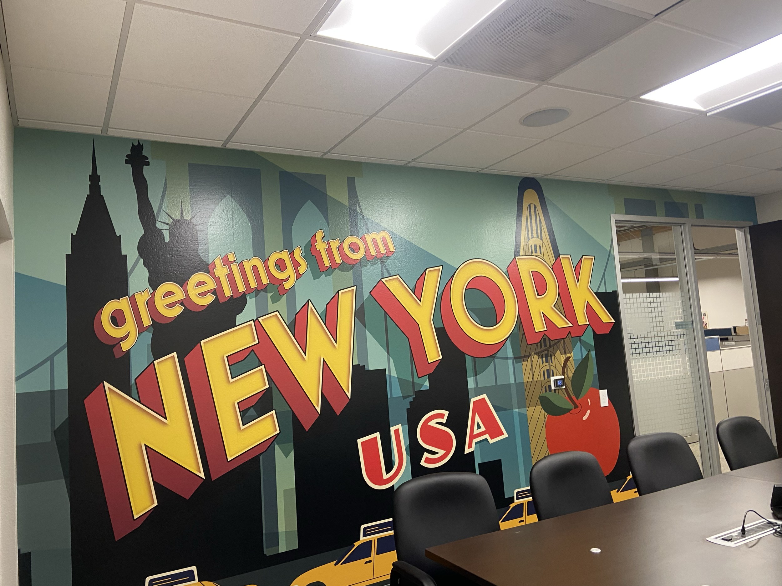 I led the remodel of the new WHSmith North America office in Las Vegas. To bring in a mid-century modern feel and reflect the states where the brand operates, I designed a series of vintage postcard graphics used as framed art and conference room wal
