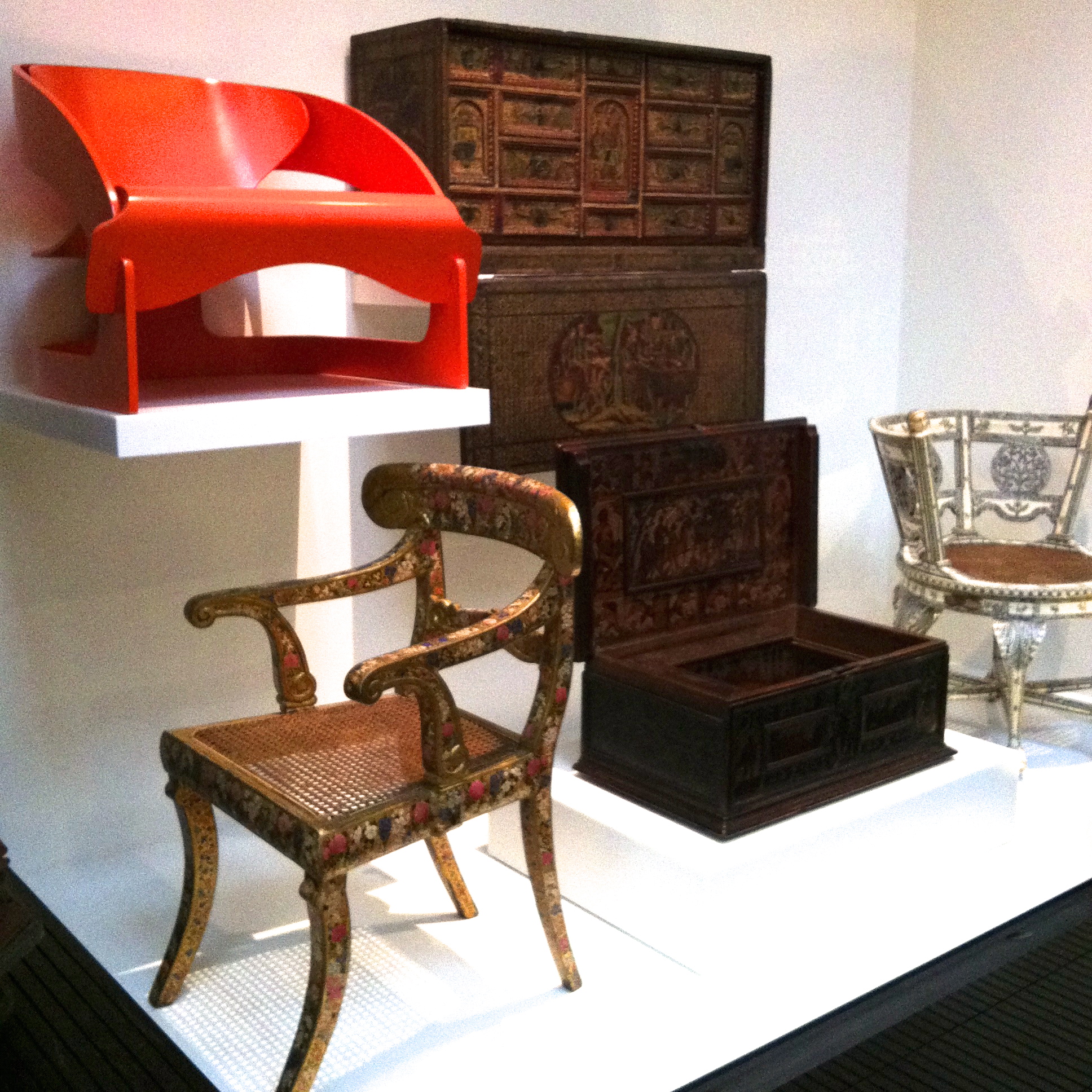 Decorative 19th Century armchair from India sits beneath Joe Columbo's 1963 Armchair