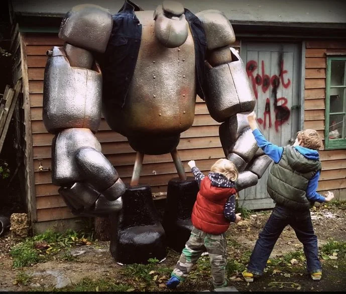 Our sons Leo and Benny squaring up to the giant robot
