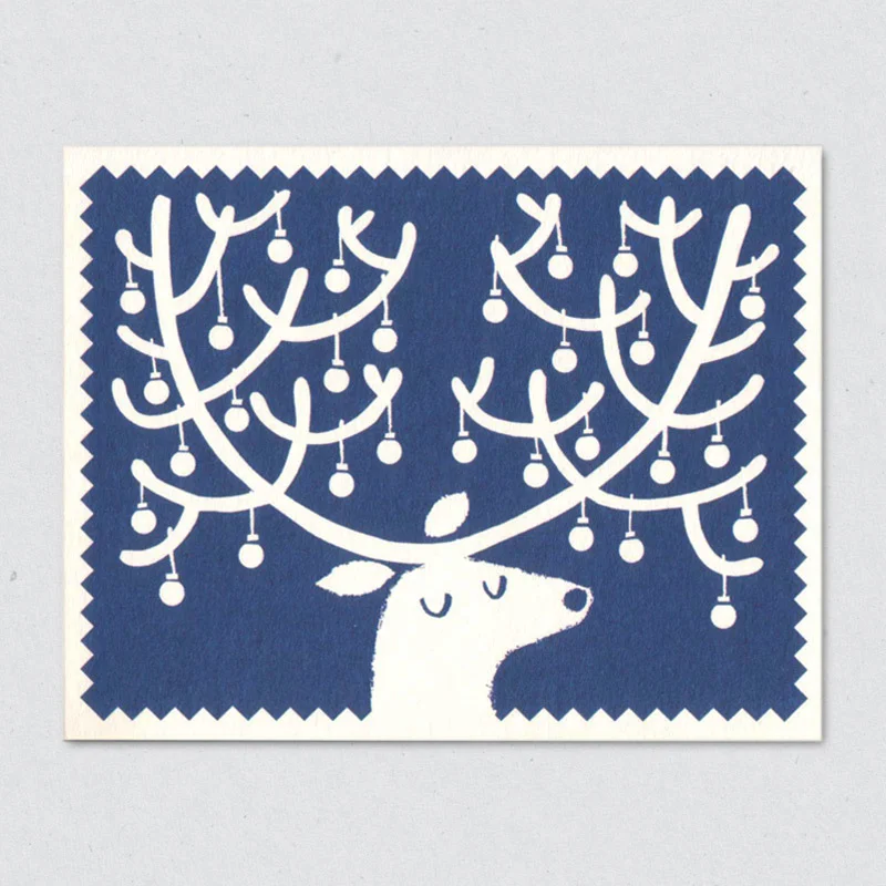 A bauble-festooned reindeer by Lisa Jones Studio