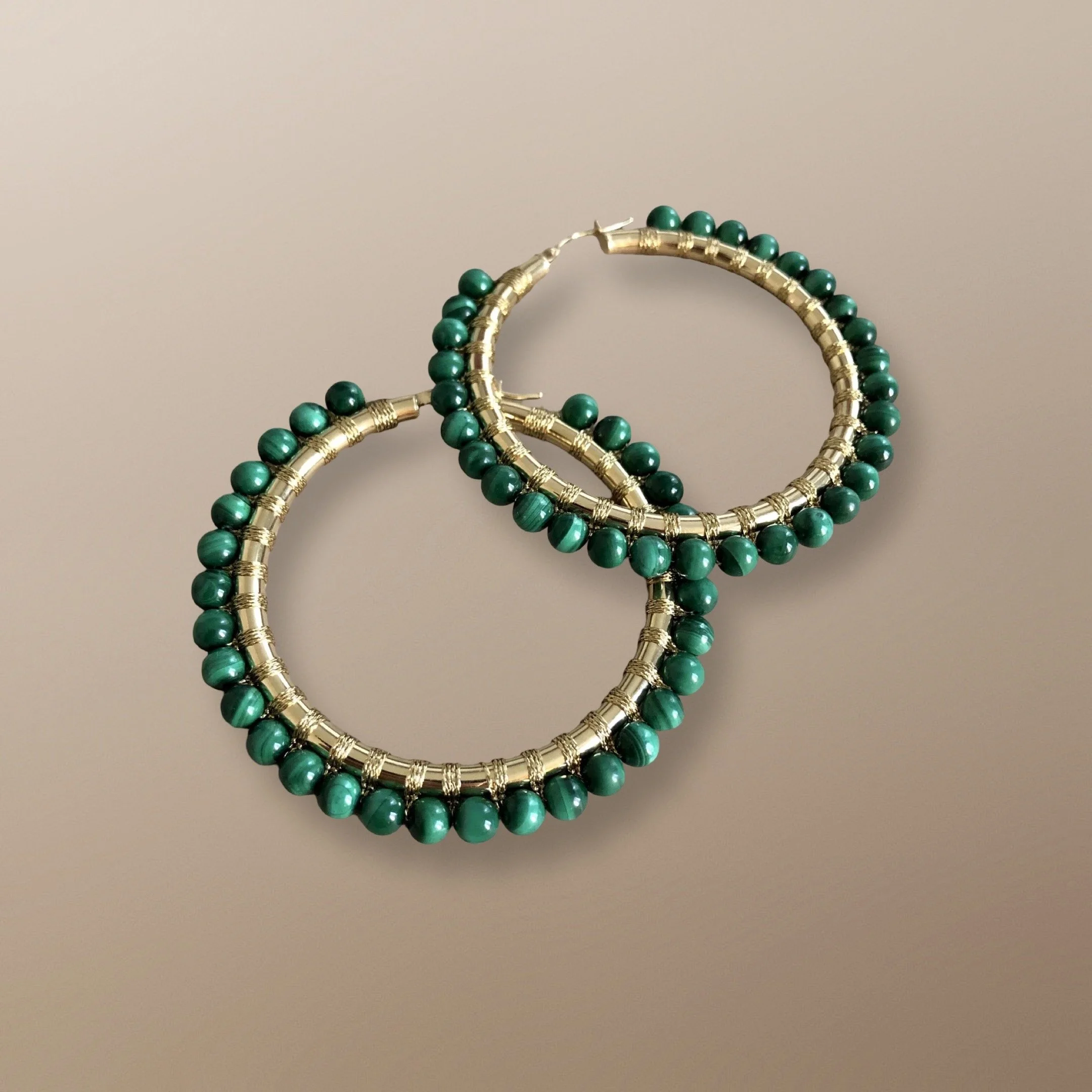 14KT GOLD HOOP HANDWOVEN WITH MALACHITE.  MALACHITE IS THE STONE OF TRANSFORMATION