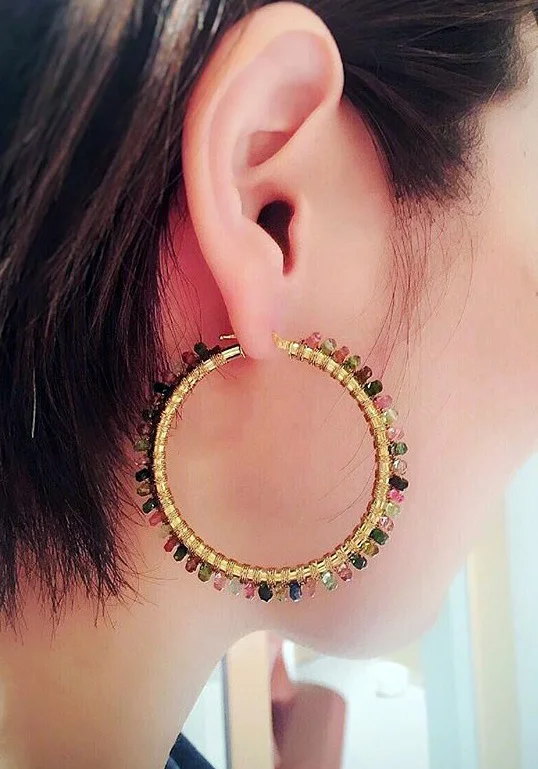 Model is wearing the 50mm size in yellow gold
