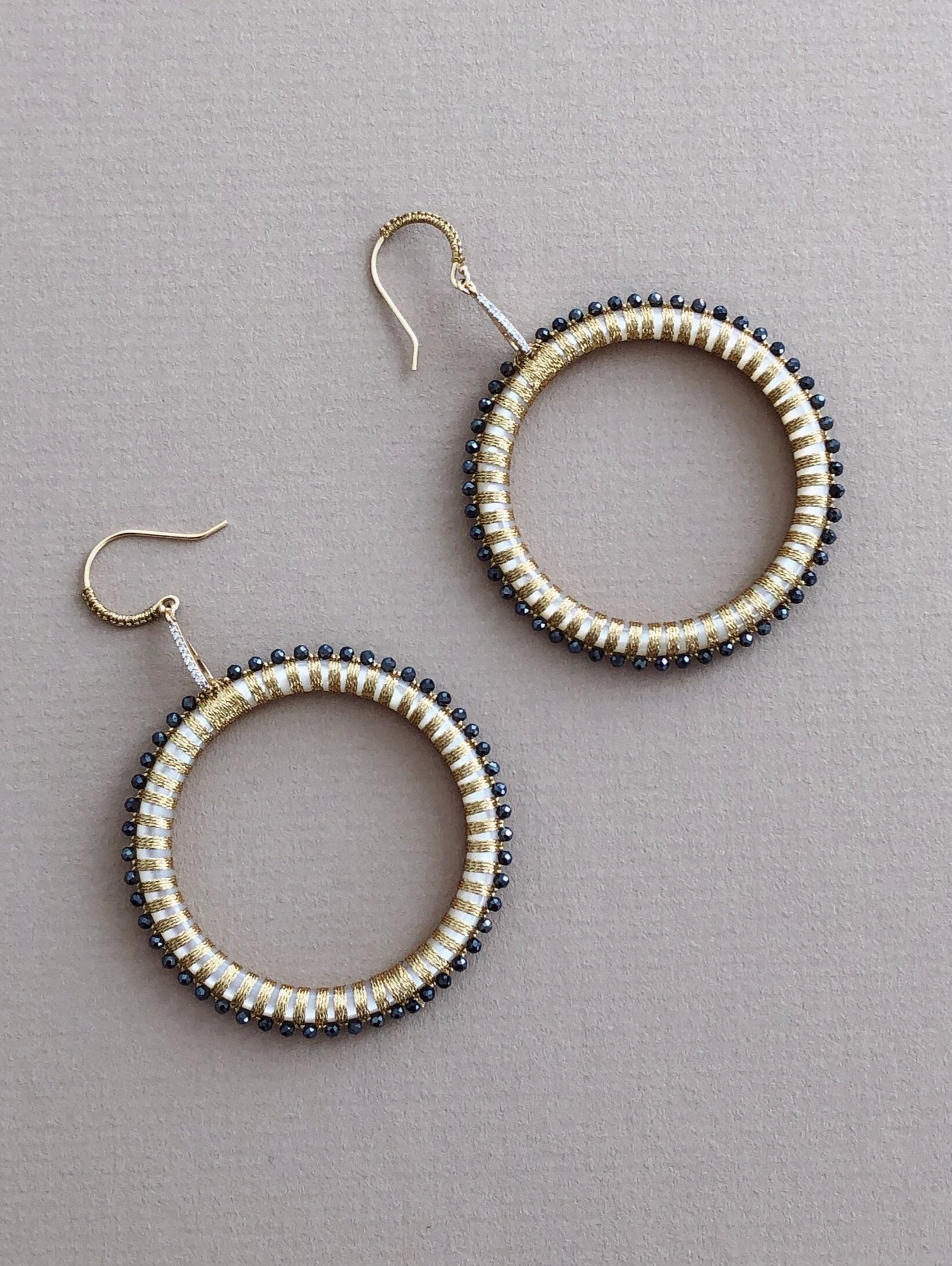 EJY100+45MM++SOUTH+SEA+MOTHER+OF+PEARL++%28PINCTADA+MAXIMA+AUSTRALIA%29+HOOPS%2C++HAND+WOVEN+WITH+MYSTIC+BLACK+SPINEL%2C+WITH+14KT+YELLOW+GOLD+AND+DIAMONDS+brd.jpg
