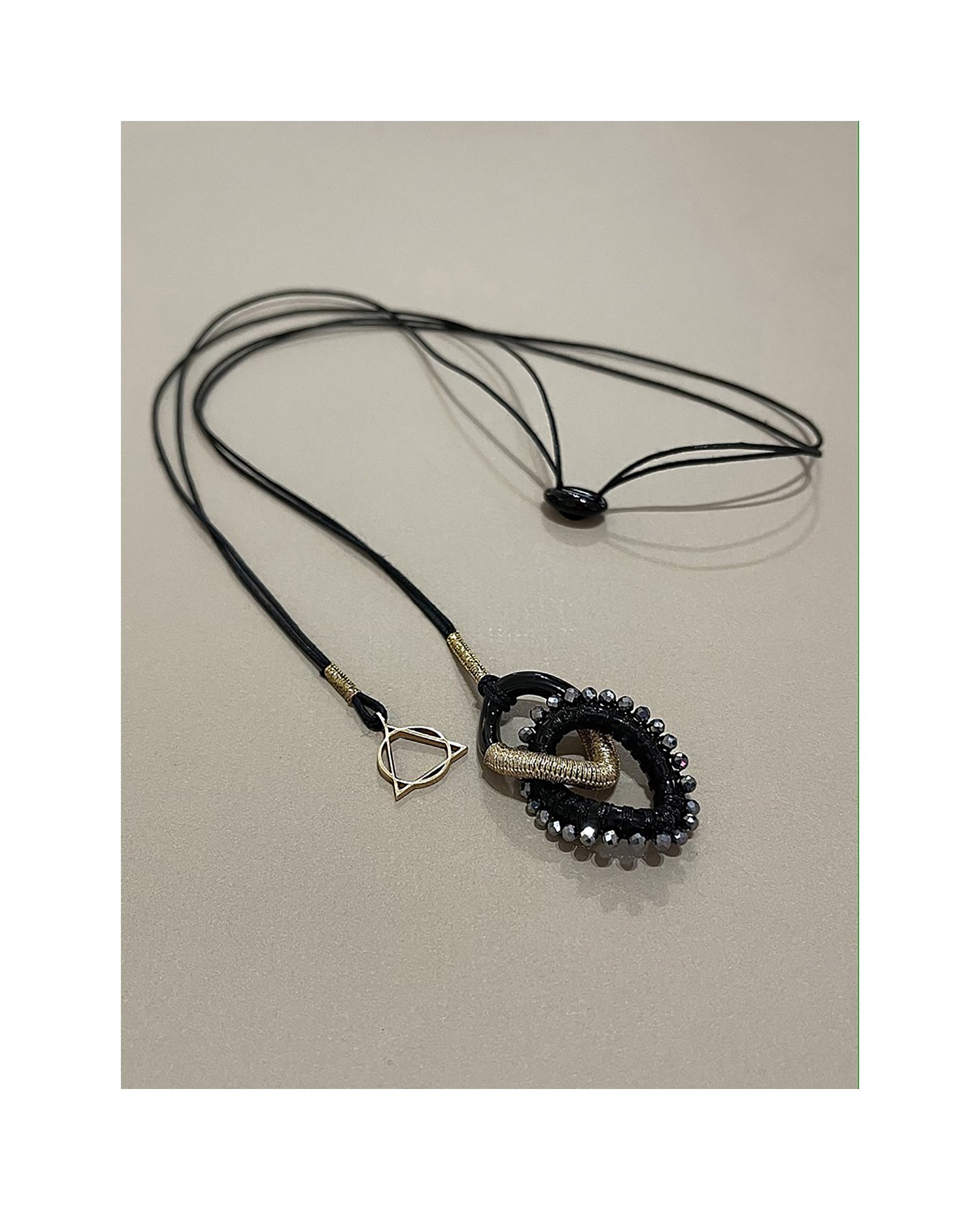 NDL103YG NECKLACE WITH BLACK AGATE CHAIN LINKS HAND WOVEN WITH GOLD AND  METALLIC BLACK CORD, AND TERAHERTZ, AND 15MM 14KT YELLOW GOLD LOGO CHARM,  BLACK AGATE SLIDE. — SIMON ALCANTARA LLC