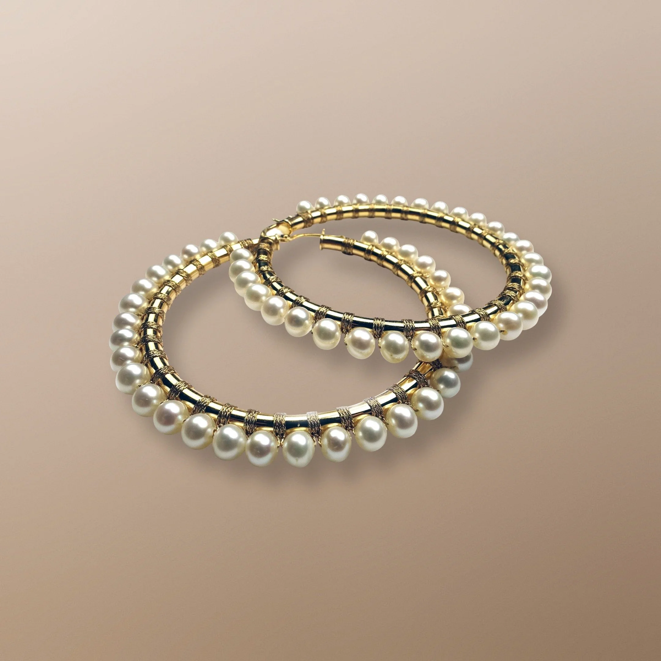 ES809-812 14KT GOLD HOOPS HAND WOVEN WITH WHITE PEARLS. PEARL IS THE STONE OF SINCERITY